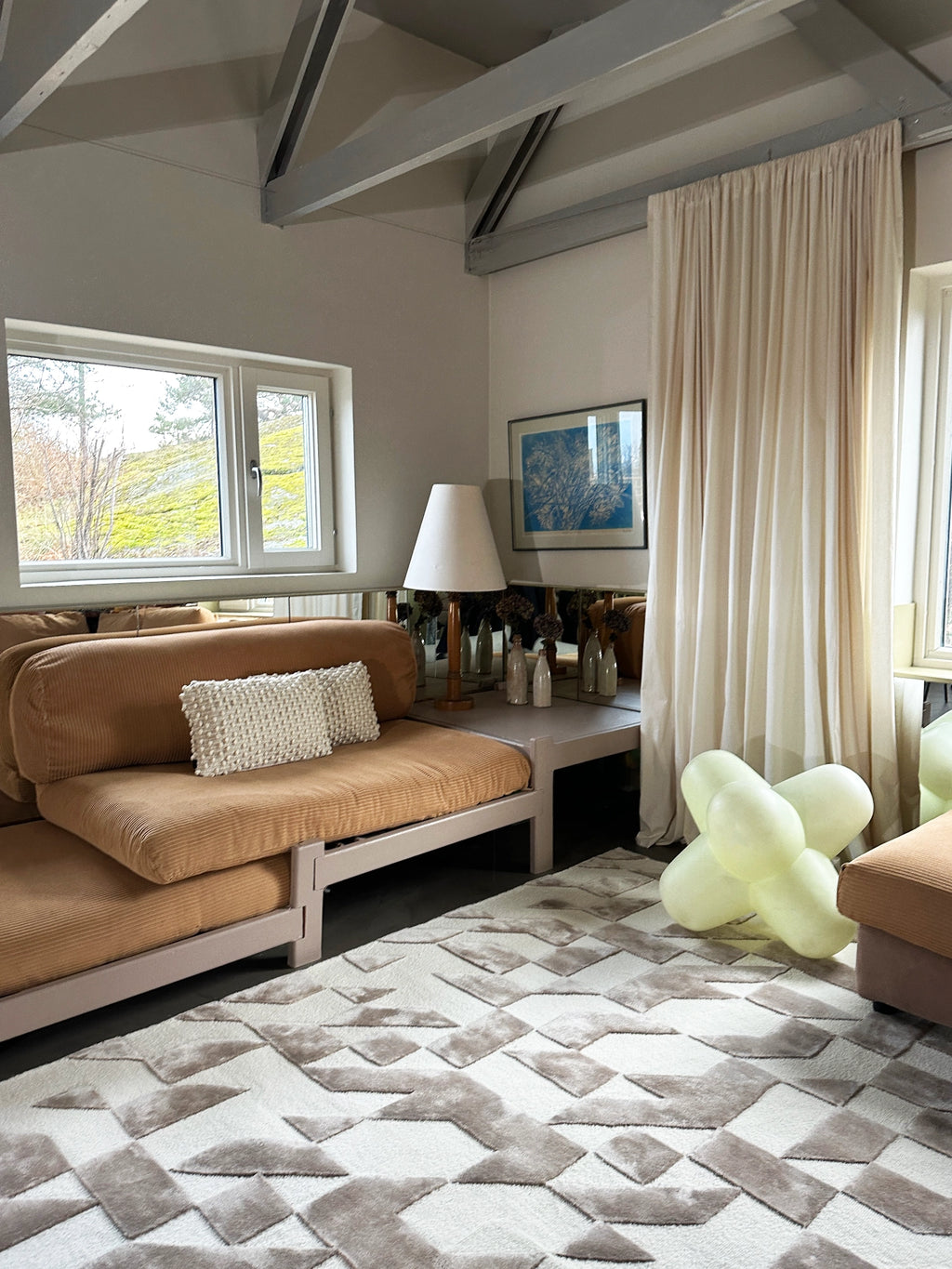 Tinted Objects Franzen Rug, a luxurious modern area rug featuring a geometric pattern in varying shades of cream and taupe with a plush, textured pile. This stylish floor covering is perfect for contemporary living rooms seeking a chic and comfortable accent.