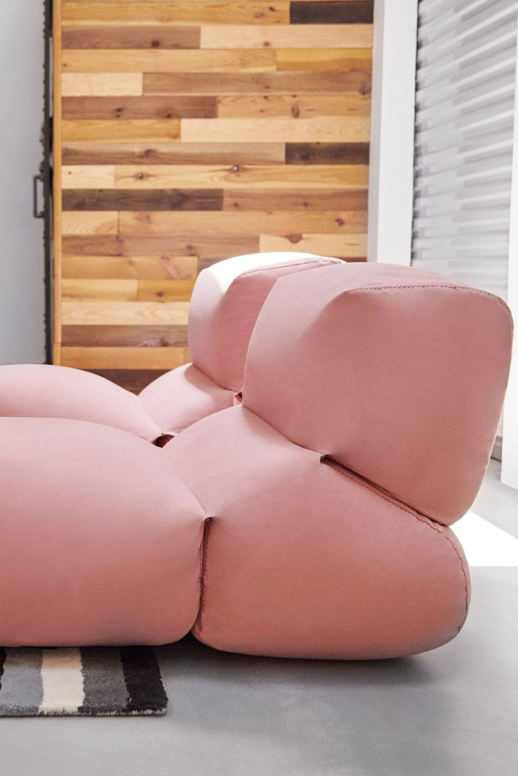 GAN Rugs Grapy Lounge Chair, a plush dusty rose lounge chair upholstered in soft fabric, featuring a distinctive modular design with organic, grape-like cushions. This contemporary accent chair offers deep, inviting comfort with its rounded forms and visible stitching, creating a sculptural and playful silhouette. Ideal for adding a touch of organic modern style to living rooms, bedrooms, or cozy reading nooks.
