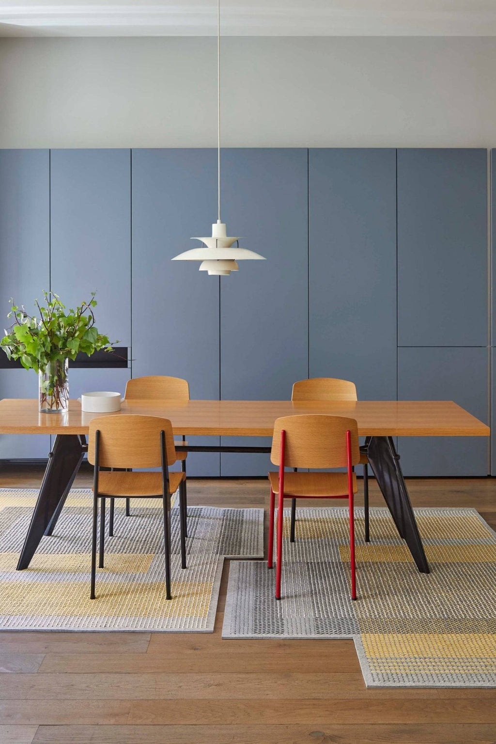 GAN Rugs Canevas Geo Rug, a modern geometric flatweave rug featuring a textured woven pattern in shades of grey, yellow, and off-white. This contemporary area rug showcases a dynamic, interlocking rectangular design with a tactile surface. Perfect for adding a pop of color and Scandinavian style to a modern dining room, living room, or minimalist interior.