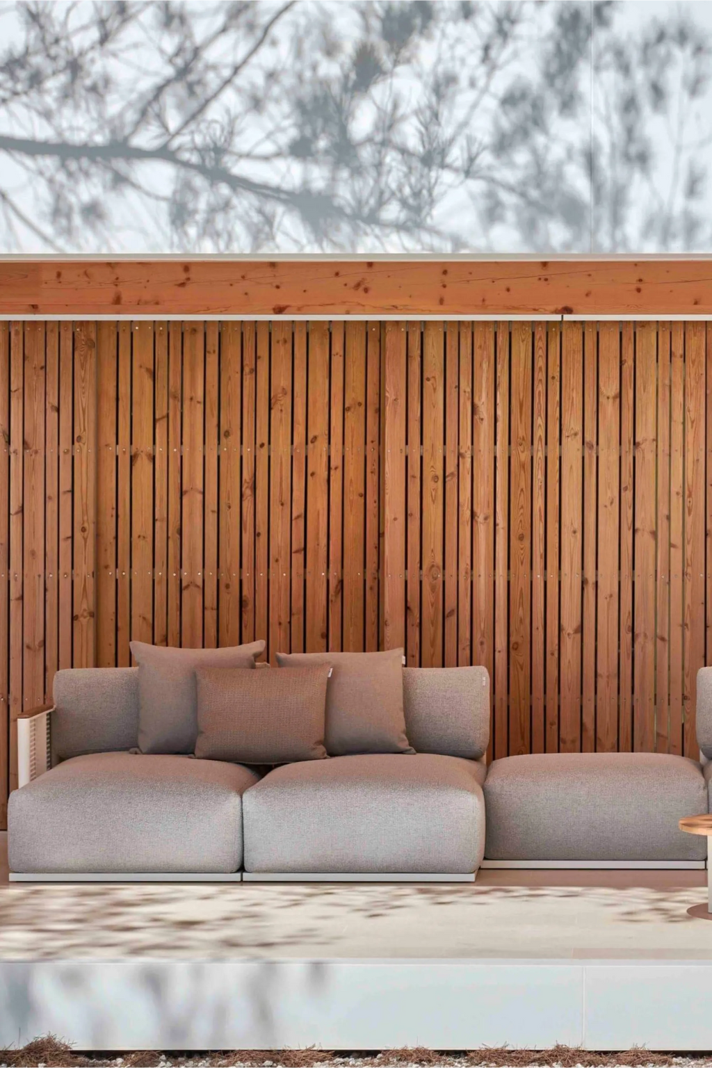 Gandia Blasco Bosc Sectional Pouf, a low-profile modular outdoor seating element upholstered in a durable light grey textured weave fabric with clean, contemporary lines and a minimalist aesthetic.