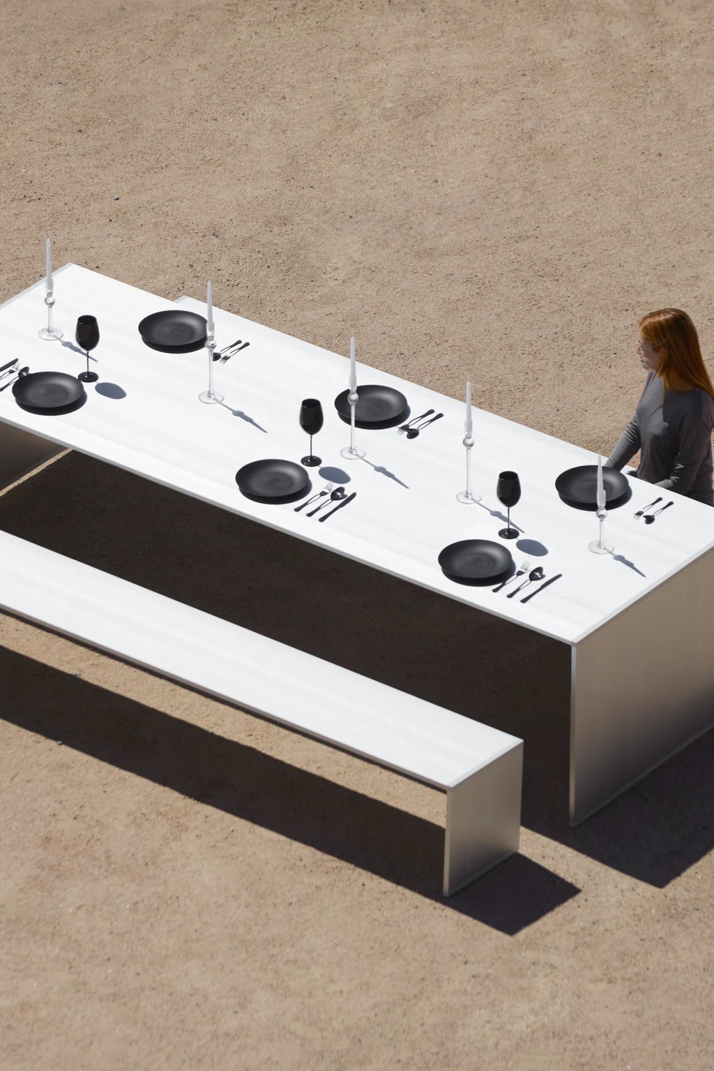Gandia Blasco GBmodular Dining Table, a sleek modern minimalist outdoor dining table and matching bench set crafted from a matte white metal with clean, architectural lines. This contemporary rectangular outdoor furniture piece offers a stark, elegant aesthetic, perfect for brutalist-inspired patios or modern garden entertaining.