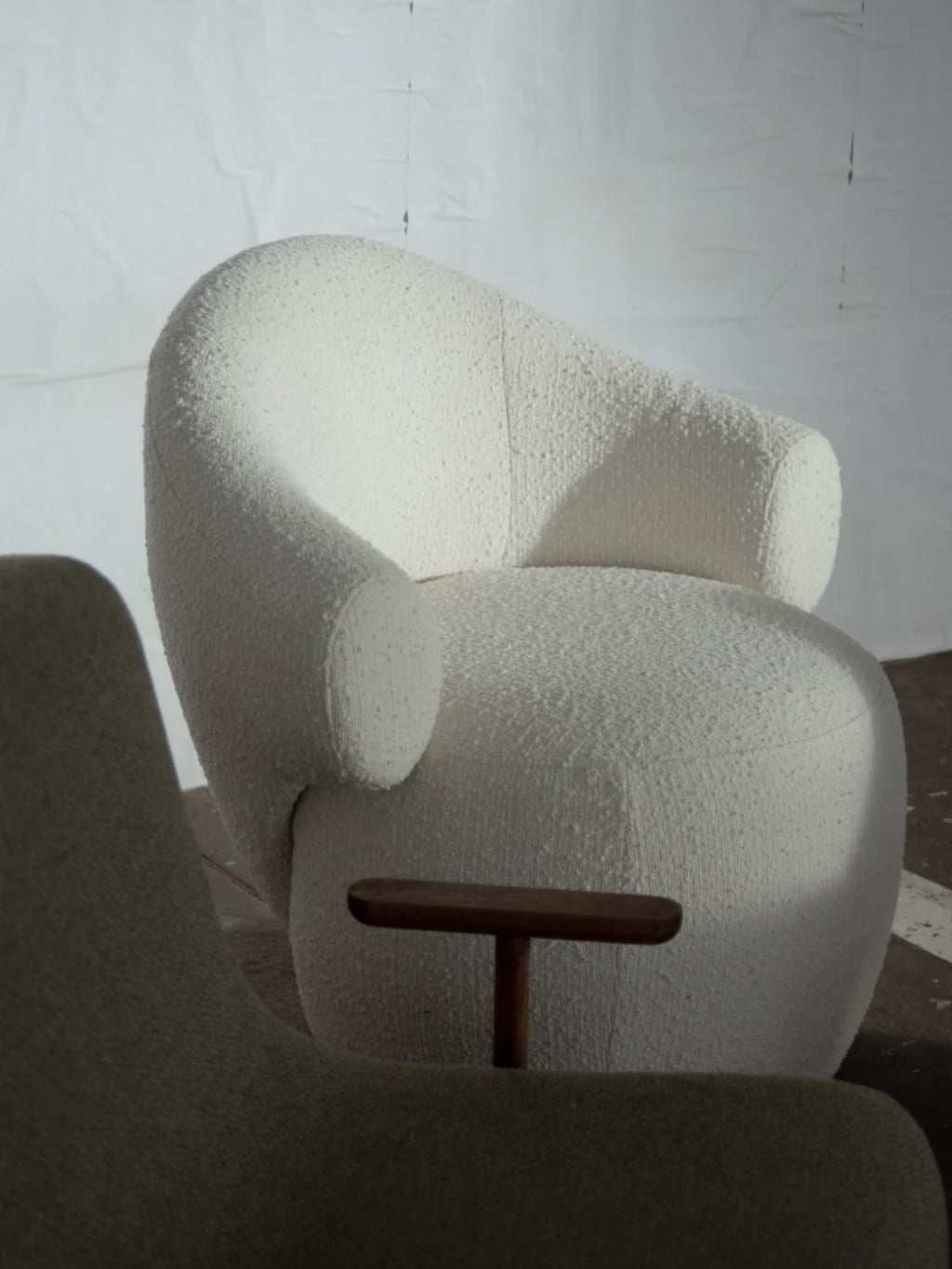 TAMO Conva Lounge Chair, a cream bouclé armchair featuring a soft, highly textured fabric and a distinct organic modern, sculptural silhouette with deep seating and inviting rounded arms. Perfect as a contemporary lounge chair for minimalist living rooms, cozy reading nooks, or a stylish bedroom accent.