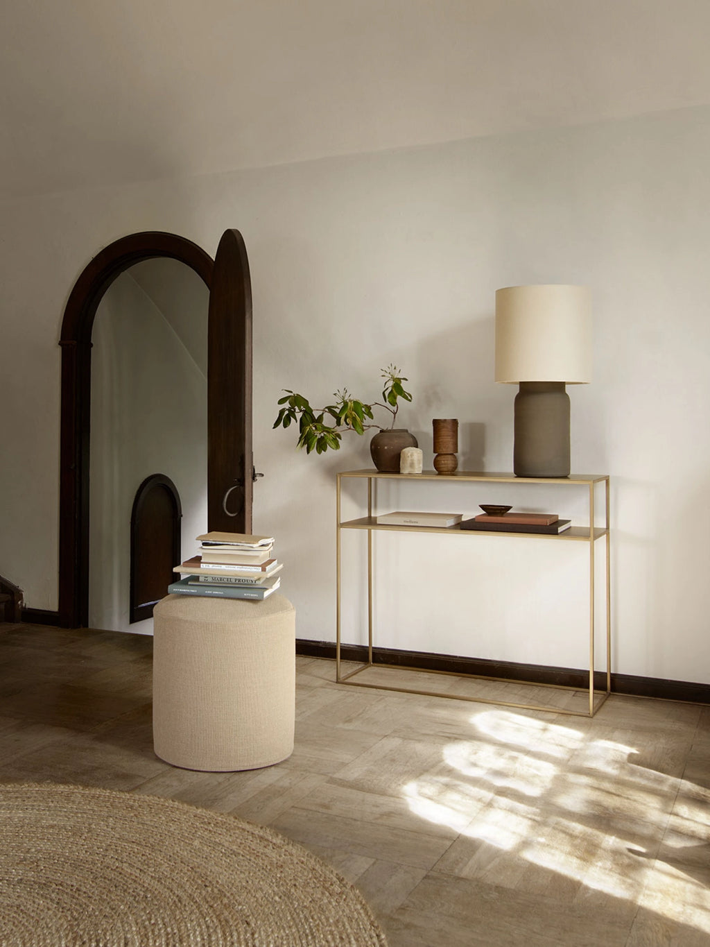 Tine K Metal Console Table, a sleek modern minimalist console table crafted from thin gold-toned metal with a two-tiered rectangular design. Its clean lines and open frame offer a light, airy aesthetic, perfect for displaying decor or books. Ideal as an entryway console table, hallway accent, or for shelf styling in Scandinavian and contemporary living spaces.