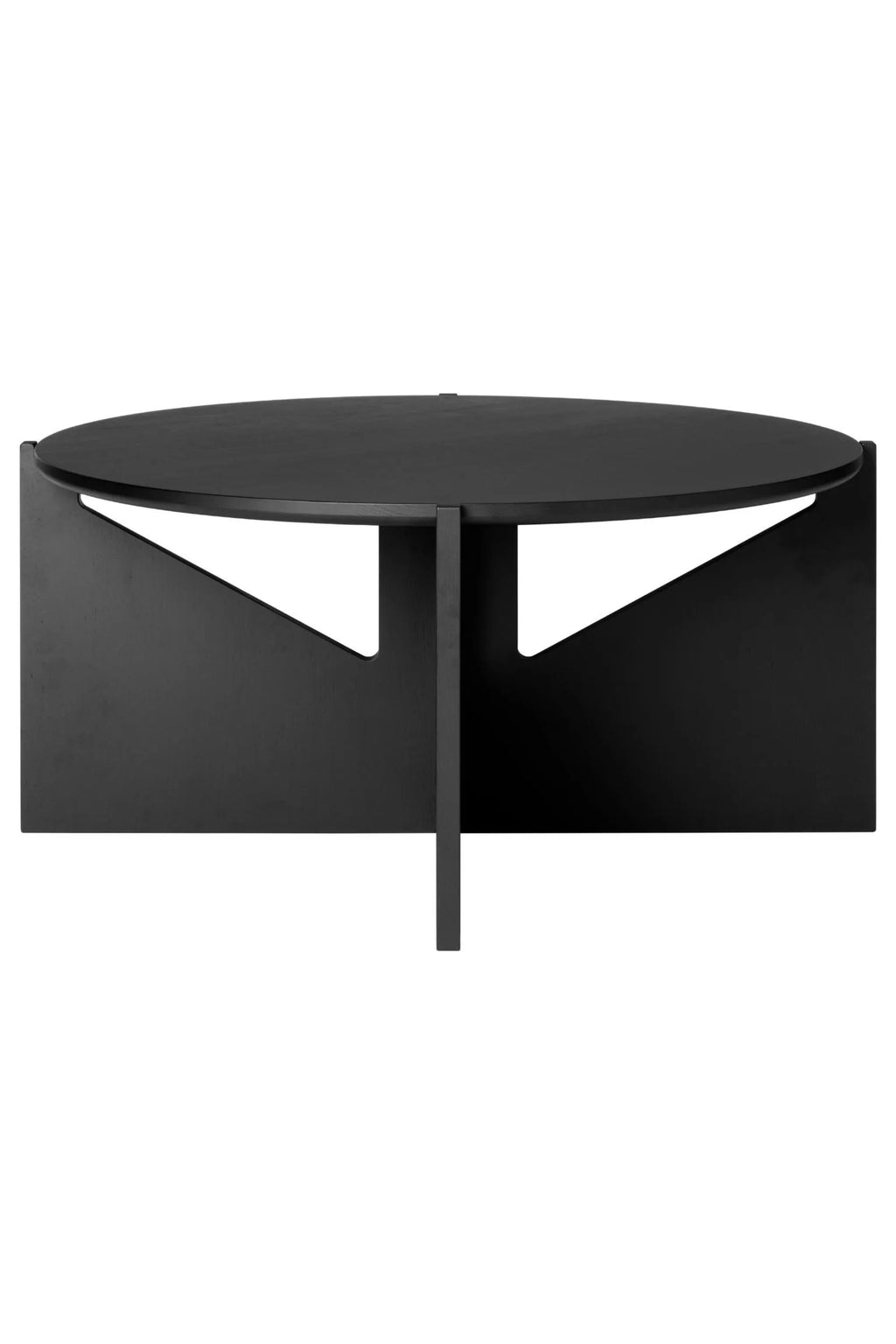 Kristina Dam Simple XL Coffee Table, a striking modern minimalist coffee table crafted from matte black solid wood with a smooth finish. It features a clean, round tabletop supported by a unique architectural base composed of a central flat column and two geometric side panels, creating a sculptural silhouette. This contemporary black wood coffee table is perfect for Scandinavian living rooms or minimalist lounge areas.