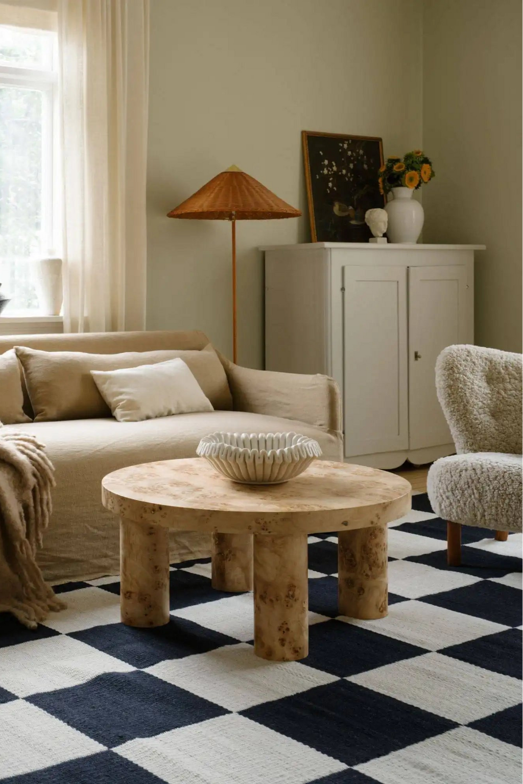 Layered Chess Wool Rug, a striking black and white checkerboard pattern area rug made from natural wool fibers. Perfect for adding a bold, graphic statement and cozy warmth to any living room or be...