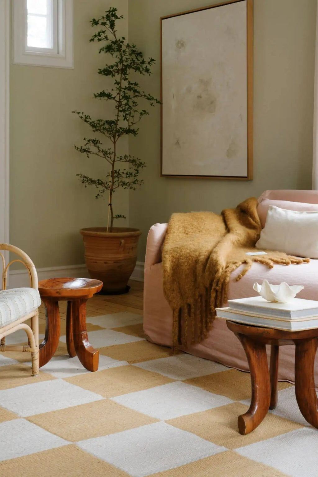 Layered Chess Wool Rug, a stylish checkerboard pattern rug in natural beige and off-white squares, made from soft, durable wool. Perfect for adding a cozy, modern accent to any living room or bedroom.