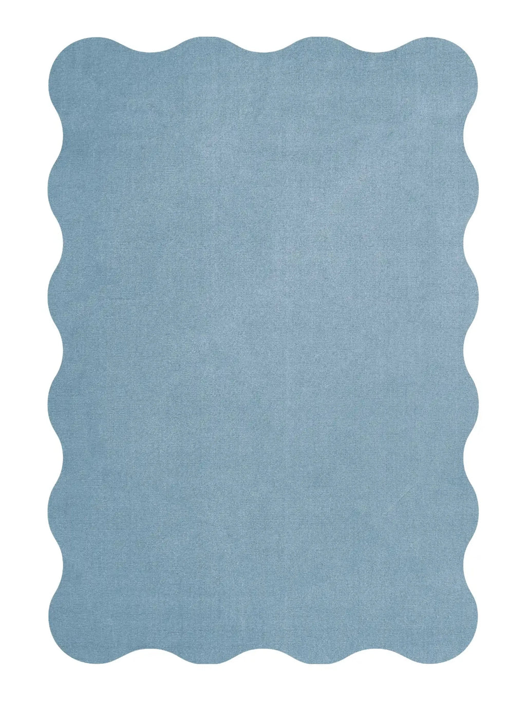 Layered Scallop Wool Rug, a light blue solid-color wool area rug with a distinctive wavy, scalloped edge design. Perfect for adding a soft, playful accent to modern living rooms or bedrooms.