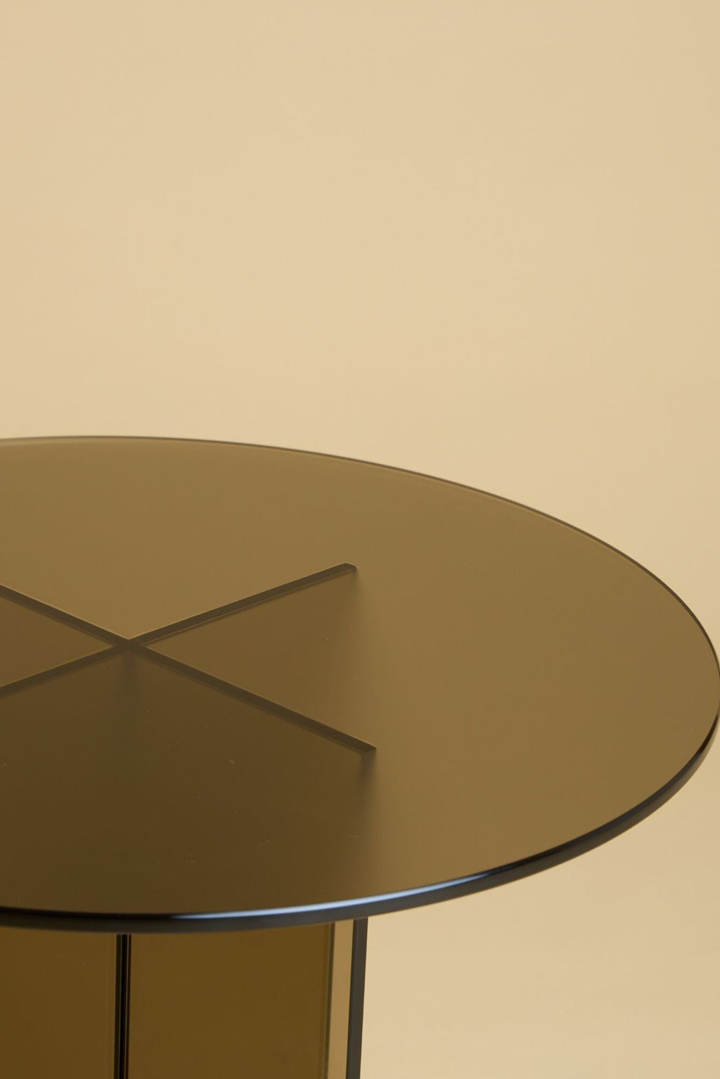 Lebanto Amami Side Table, a striking modern minimalist accent table featuring a round dark smoked glass tabletop and a sculptural, architectural base formed by intersecting vertical panels of matching smoked glass.