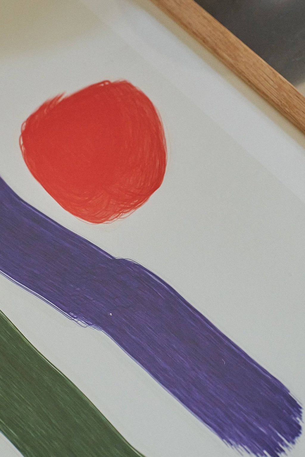 The Poster Club Volare, a vibrant abstract art print featuring a bold red organic shape and expressive purple and green brushstrokes on a crisp white background, framed in natural light oak. This contemporary poster is perfect for adding a playful pop of color to modern minimalist living rooms, creative home offices, or gallery walls.