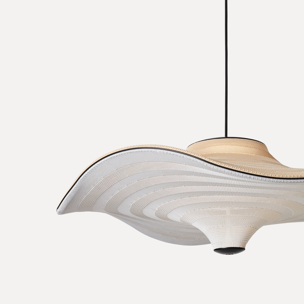 Made by Hand Flying Ø96 Pendant Lamp, a large organic modern suspension light featuring a wide, undulating shade crafted from natural hand-woven cream-colored textile, detailed with a subtle black rim and.