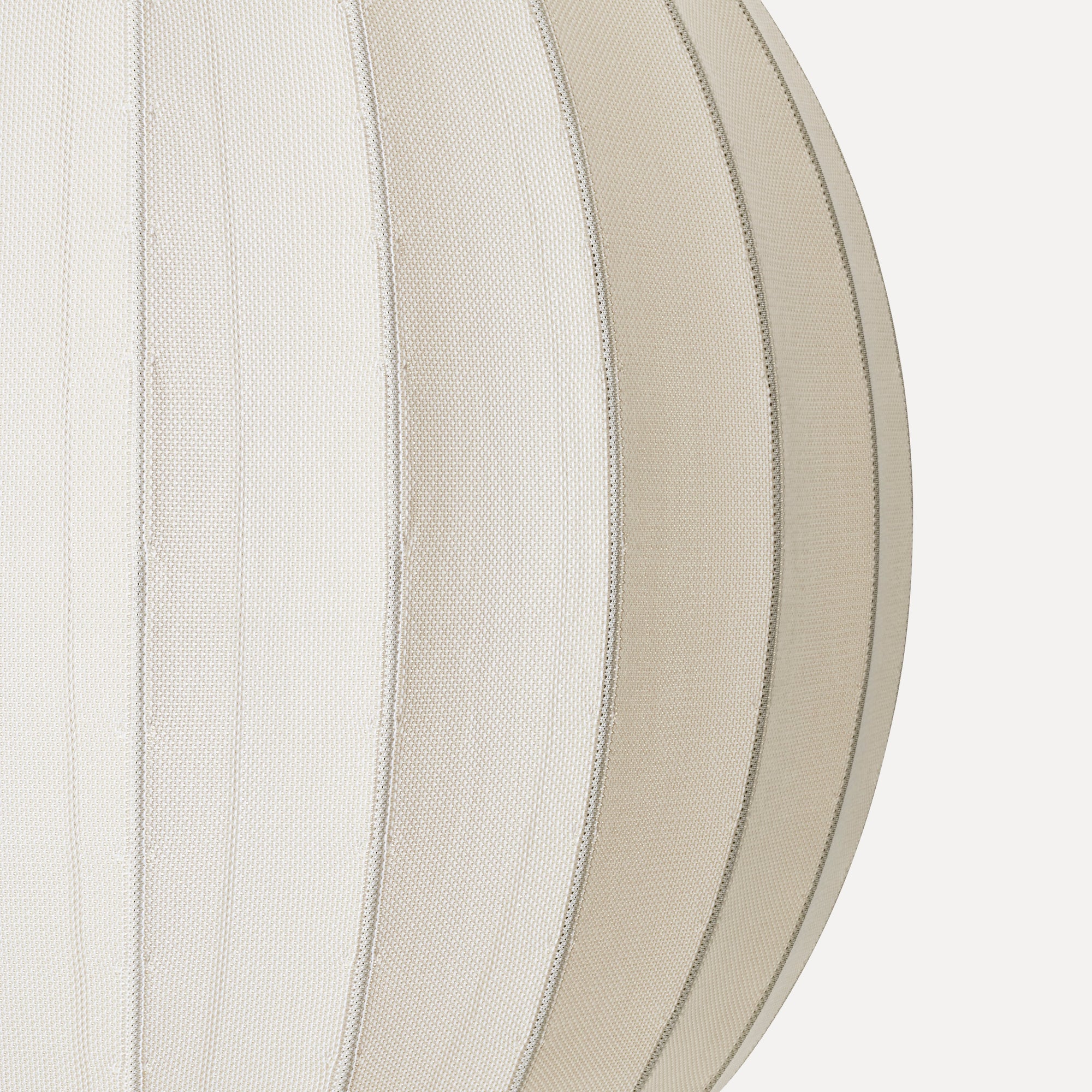 Made by Hand Knit-Wit Ø45 Oval Pendant Lamp, a cream-colored Scandinavian pendant light crafted from a unique fine knit textile fabric with a subtle textured weave and elegant ribbed seams forming its soft,.