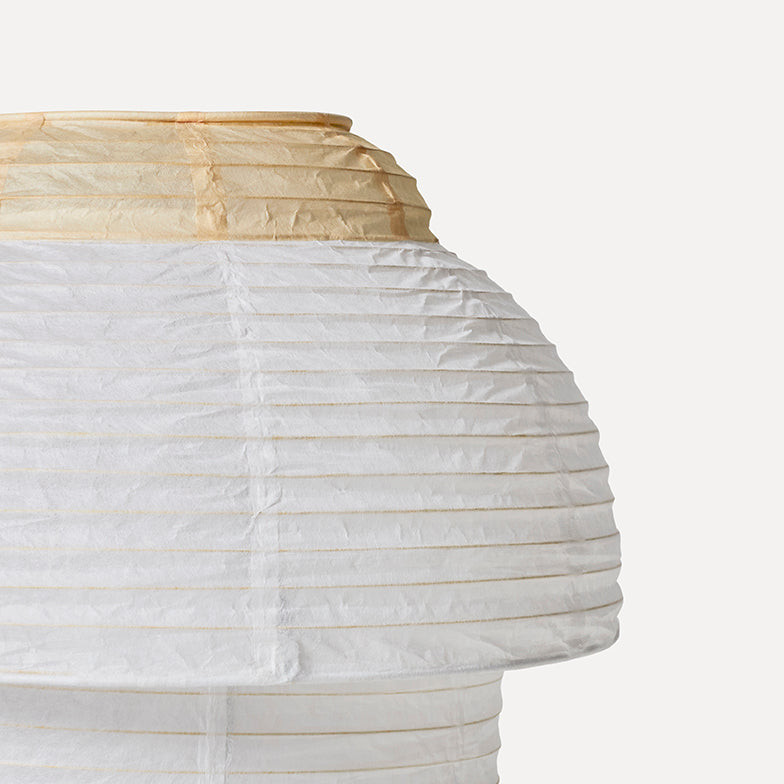Made by Hand Papier Double Ø30 Table Lamp, a Japanese-inspired paper lantern table lamp with a tiered rounded silhouette, featuring a cream-colored pleated paper top and a white crinkled paper body.