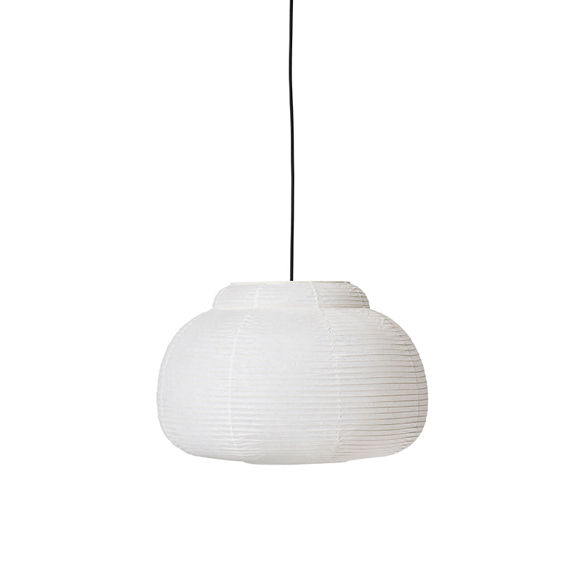Made by Hand Papier Single Ø52 Pendant Lamp, a white handcrafted paper pendant lamp with a distinctive ribbed texture and a soft, organic, flattened globe silhouette. Its Japanese-inspired design features a gently stacked top section, evoking a modern minimalist or Japandi aesthetic. This elegant ceiling light is perfect for creating a warm ambiance in Scandinavian living rooms, serene bedrooms, or contemporary dining spaces.