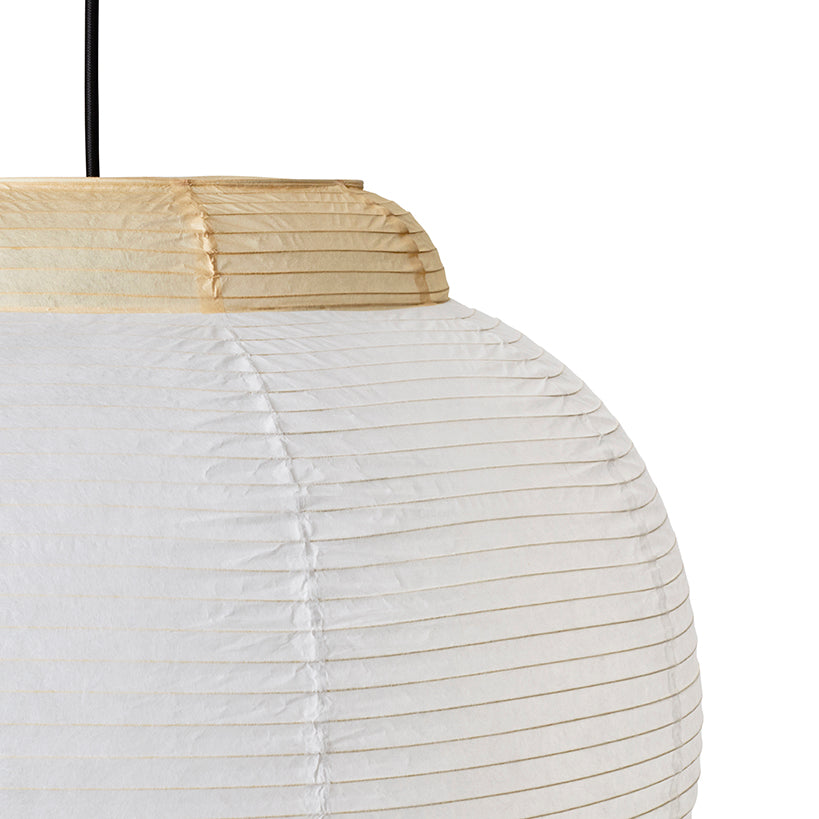 Made by Hand Papier Single Ø52 Pendant Lamp, a minimalist white paper lantern with a gently ribbed, spherical shape and natural pleated texture, accented by a light beige paper top and black suspension cord. This Japandi-inspired ceiling light provides soft, ambient illumination for Scandinavian living rooms, serene bedrooms, or cozy dining spaces.