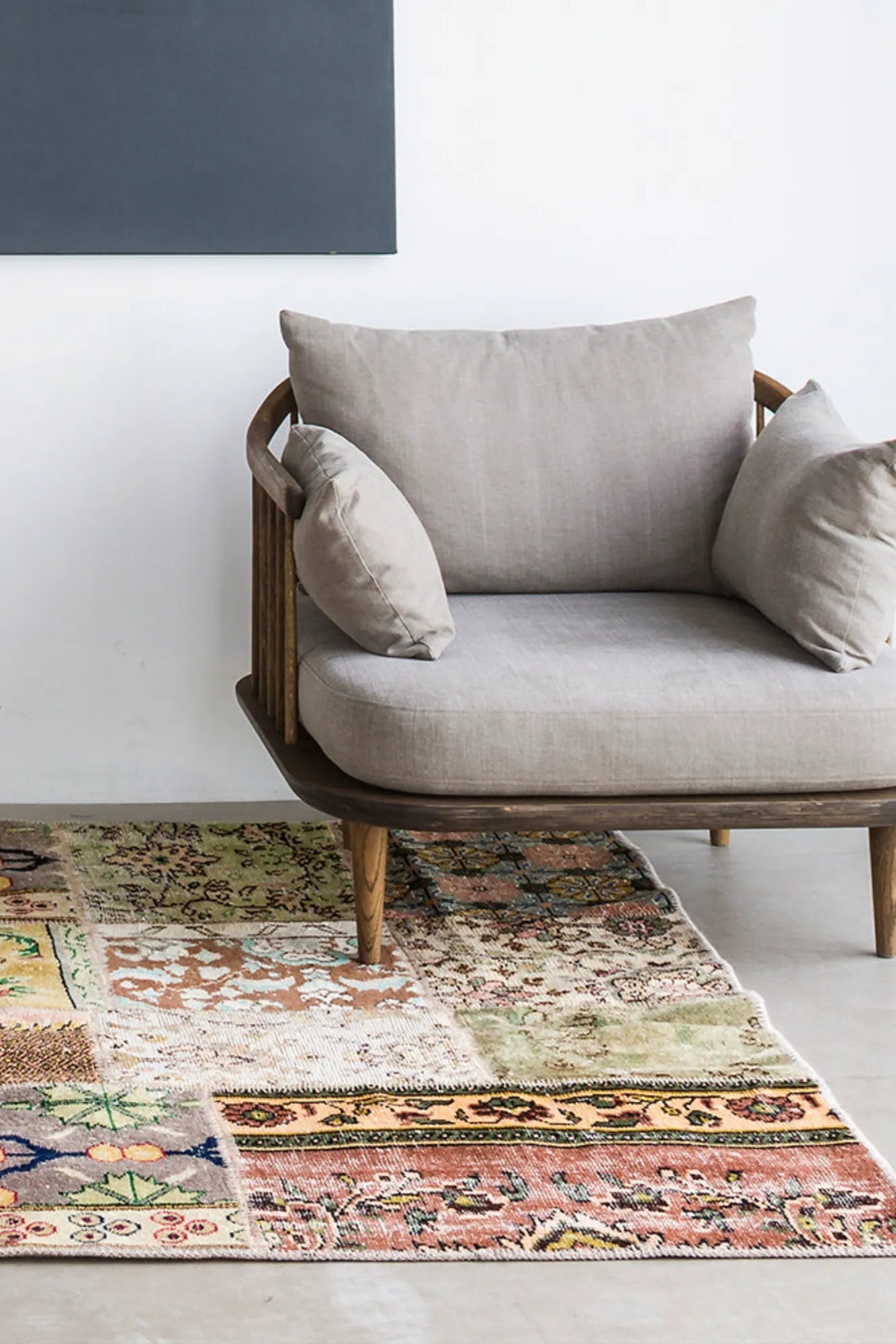 Handwoven vintage rug with intricate red and blue floral patterns