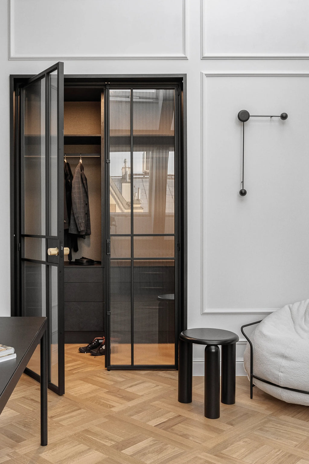 TAMO Neo Side Table in a modern living space, featuring a matte black finish with three thick cylindrical legs and a smooth circular top. A premium, minimalist design perfect for contemporary interiors.