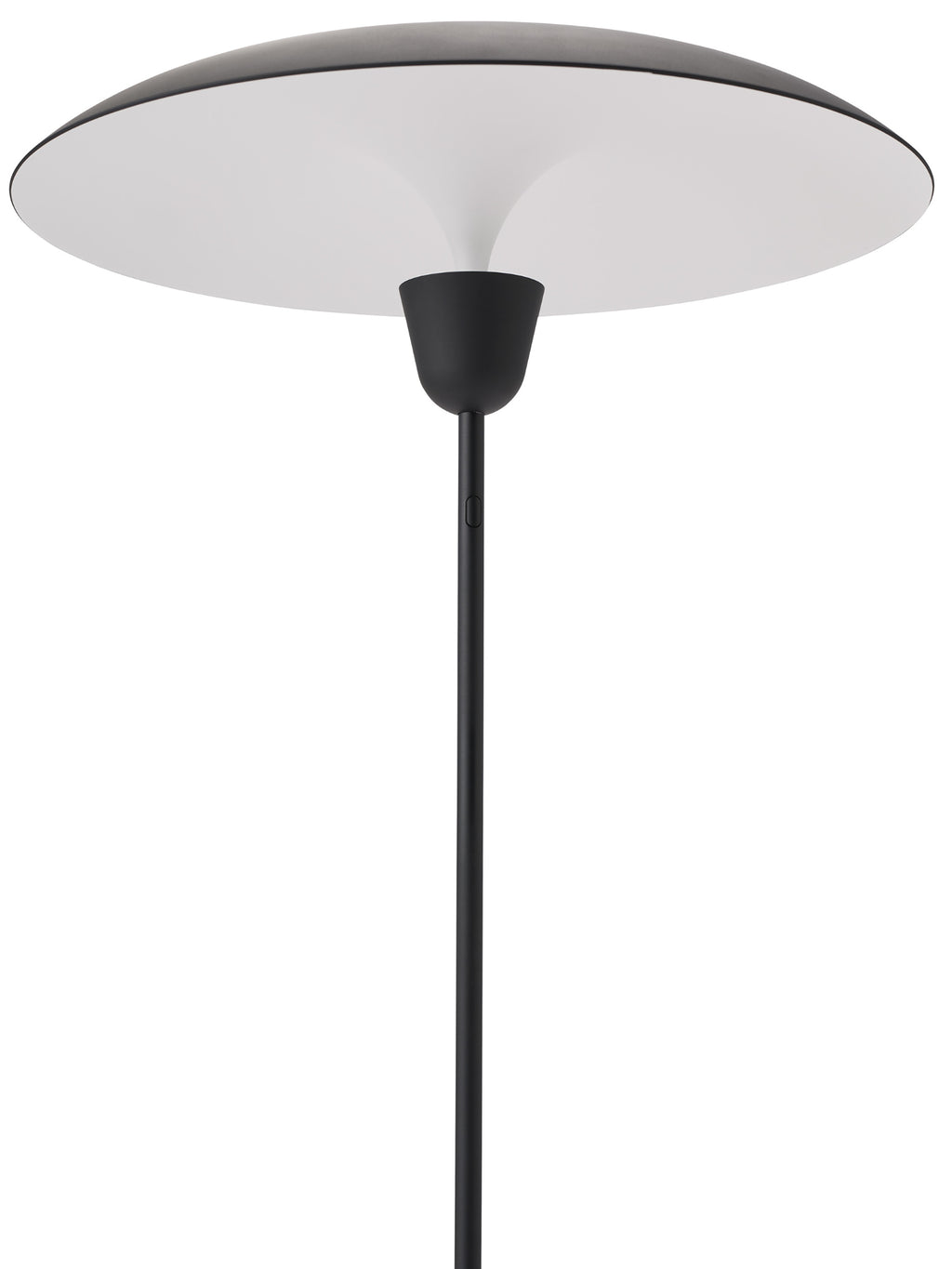 New Works Kantarell Floor Lamp, a modern minimalist floor lamp featuring a sleek matte black metal finish and a distinctive wide, shallow, organic disc-shaped shade. The shade's clean white underside provides soft, diffused light, contrasting elegantly with the slender black stem. Ideal as a Scandinavian living room lamp, contemporary reading lamp, or stylish bedroom accent for modern interiors.