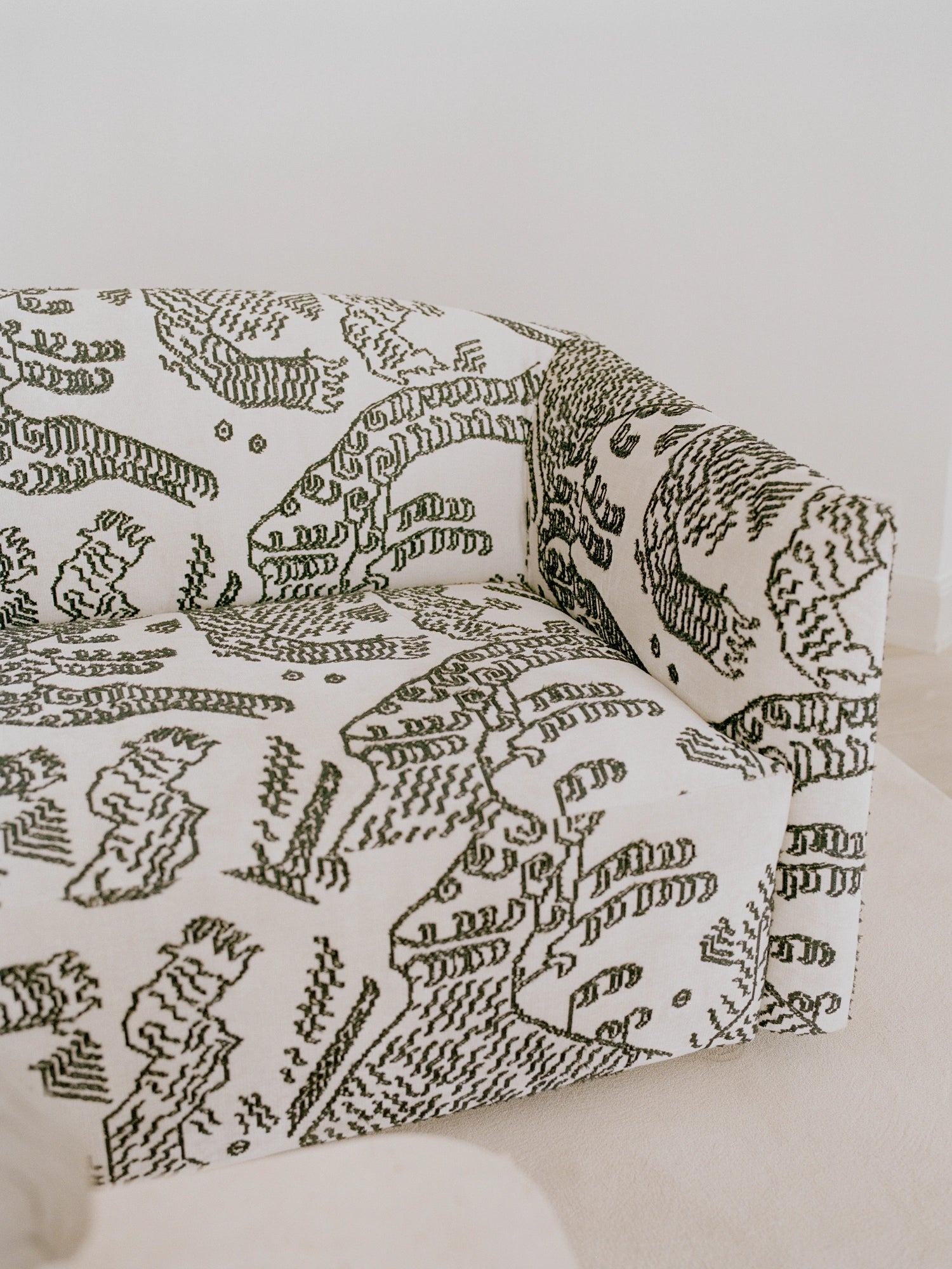 New Works Shore Sofa 3-Seater - Extended Base, showcasing a close-up of its luxurious, textured fabric in a striking black and white abstract pattern, highlighting the contemporary design and premium material quality.