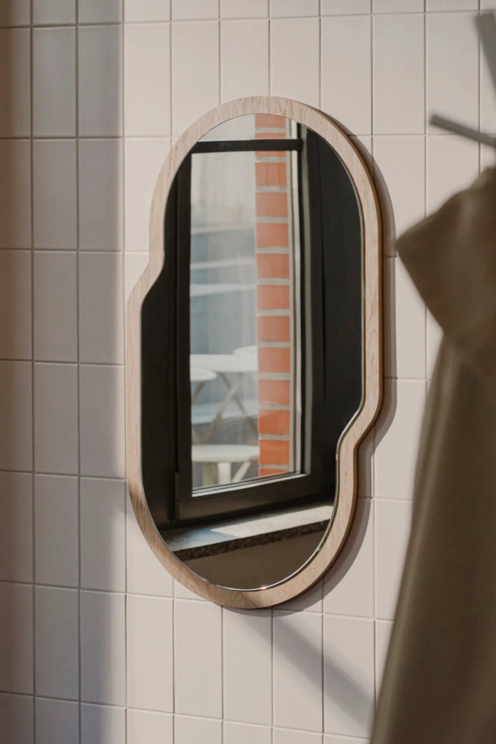 A close-up of the intricate detailing on the Tafla Mirror's frame