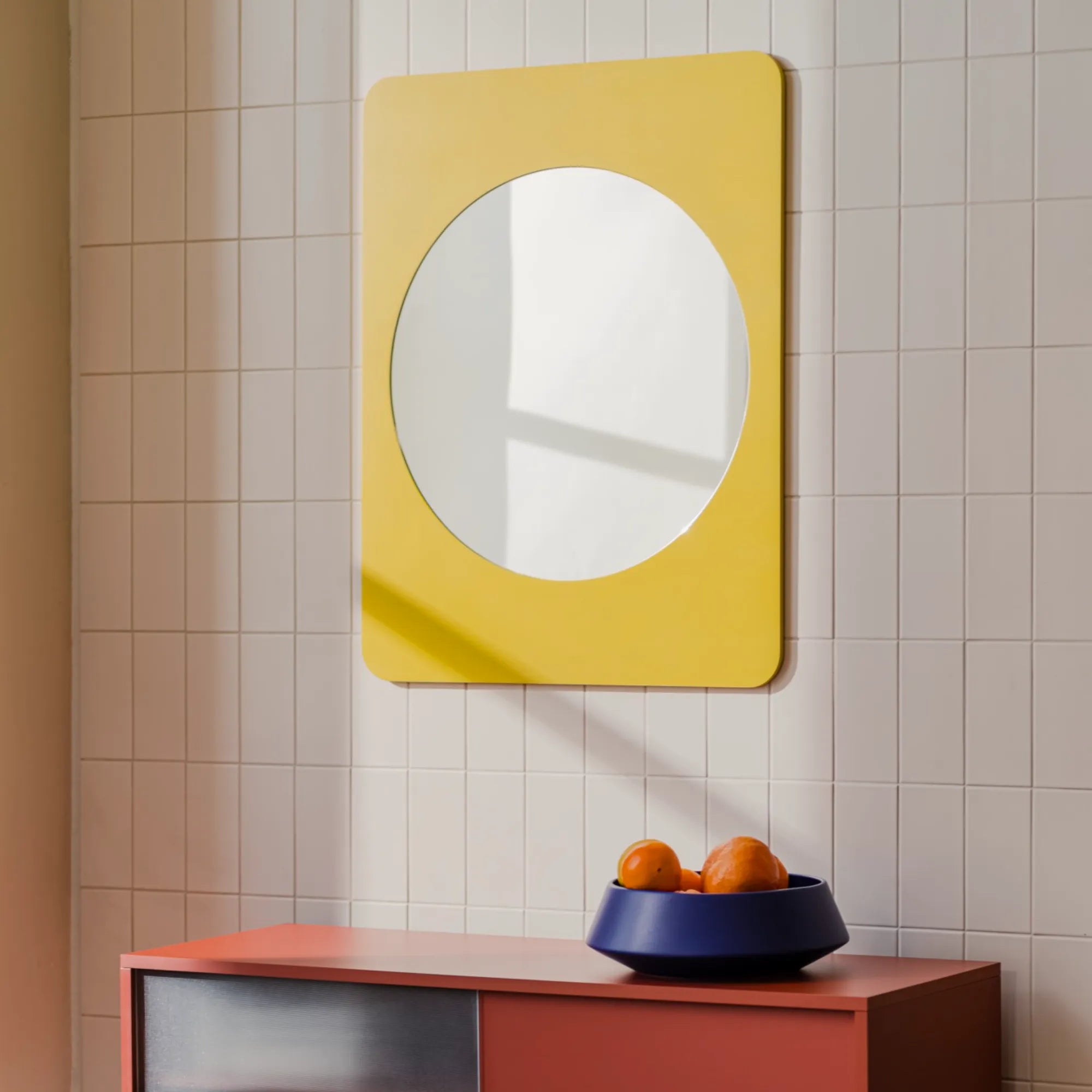 Aku Mirror with gold frame and geometric design reflecting room interior