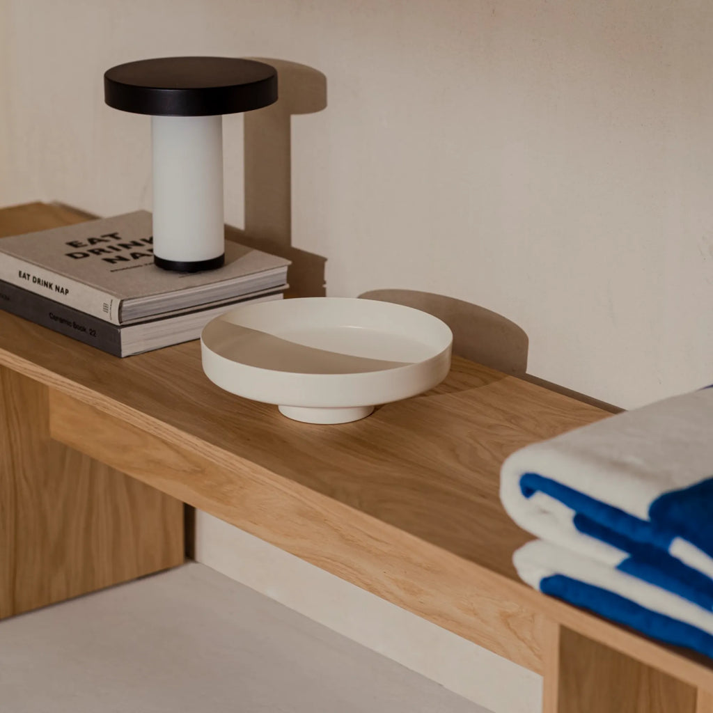  Vilu Bowl with a natural wood finish adding warmth to a dining room display