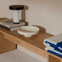 Vilu Bowl with a natural wood finish adding warmth to a dining room display