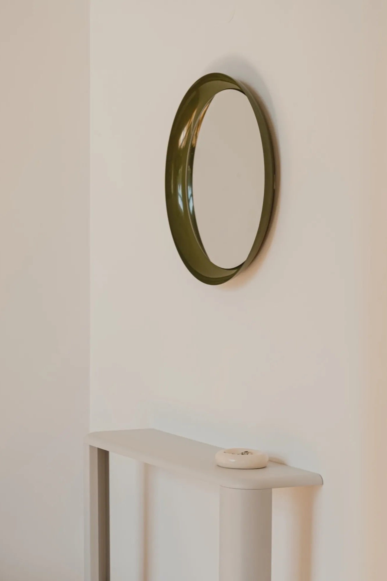 Allo Mirror reflecting elegant interior design with soft ambient lighting