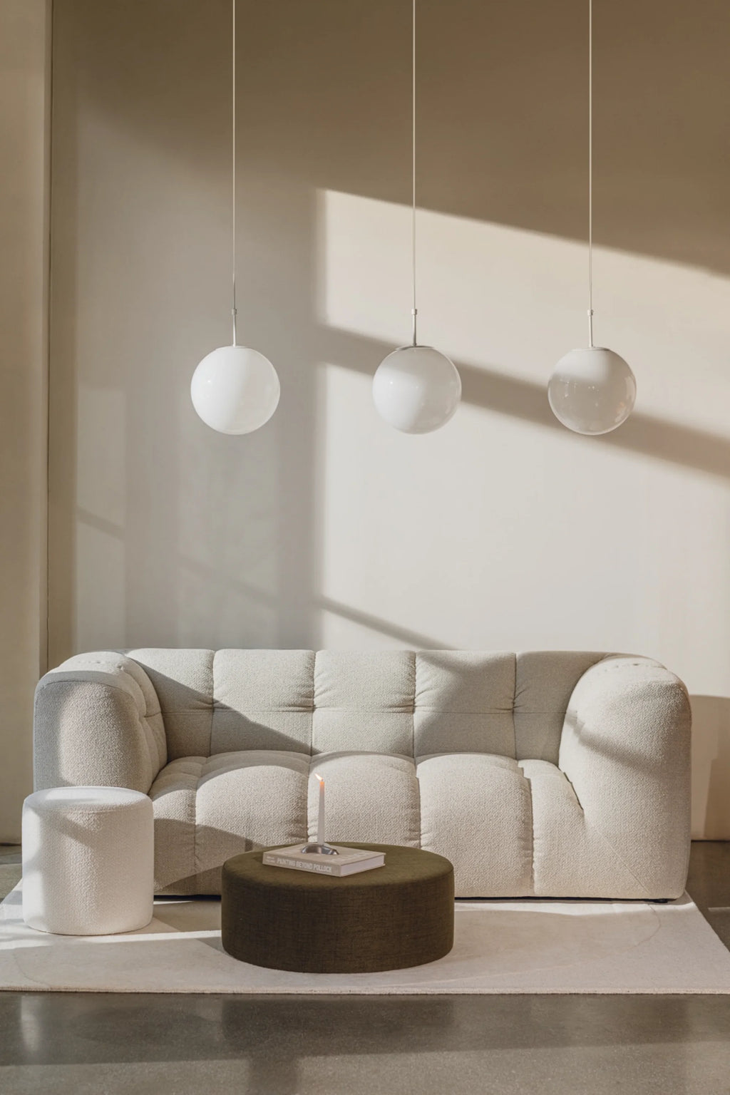 noo.ma Bolbi Sofa 2-seater, a contemporary 2-seater sofa upholstered in plush, textured cream bouclé fabric with deep tufting across the back and seat cushions.