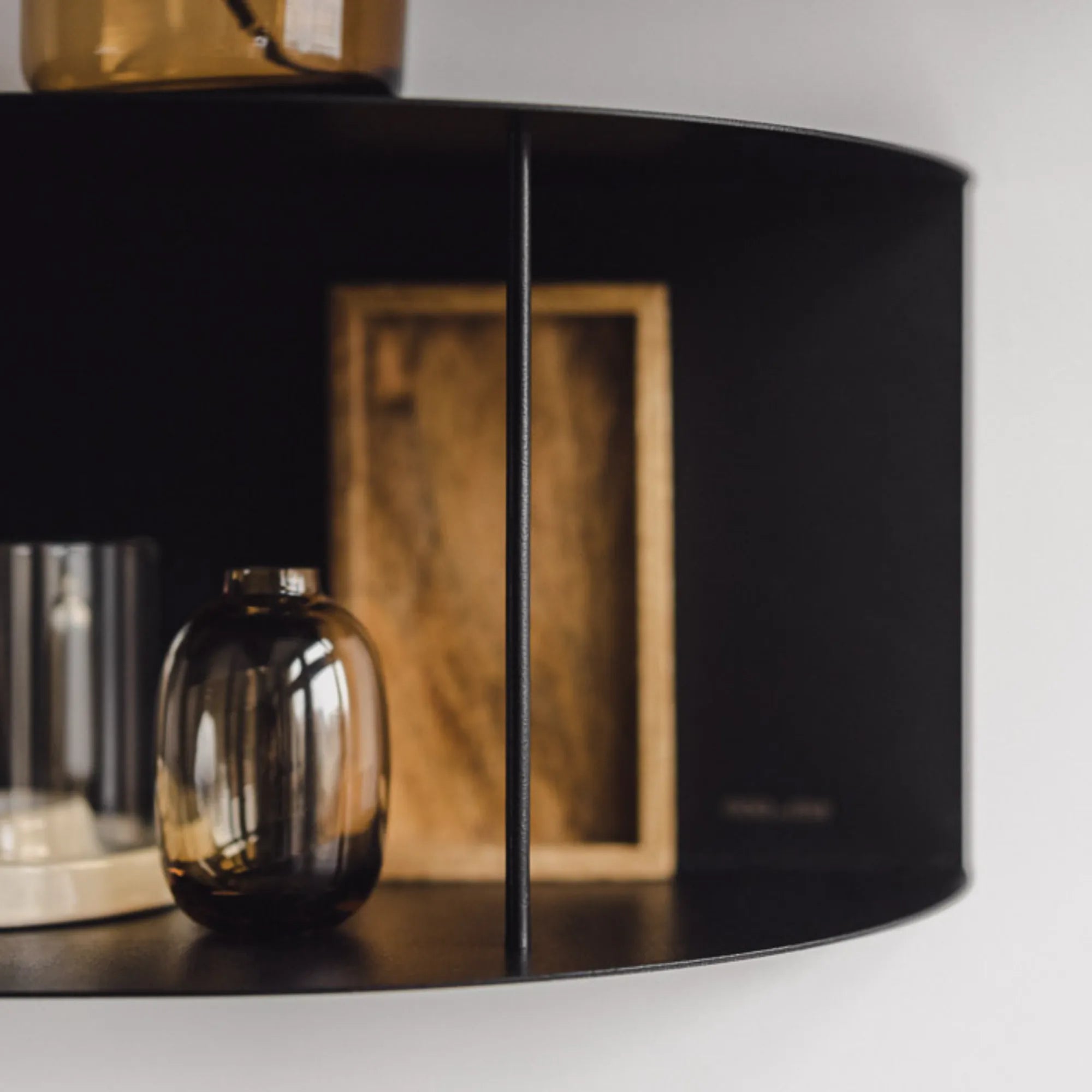 Lina Shelf in black finish, adding an elegant touch to any room