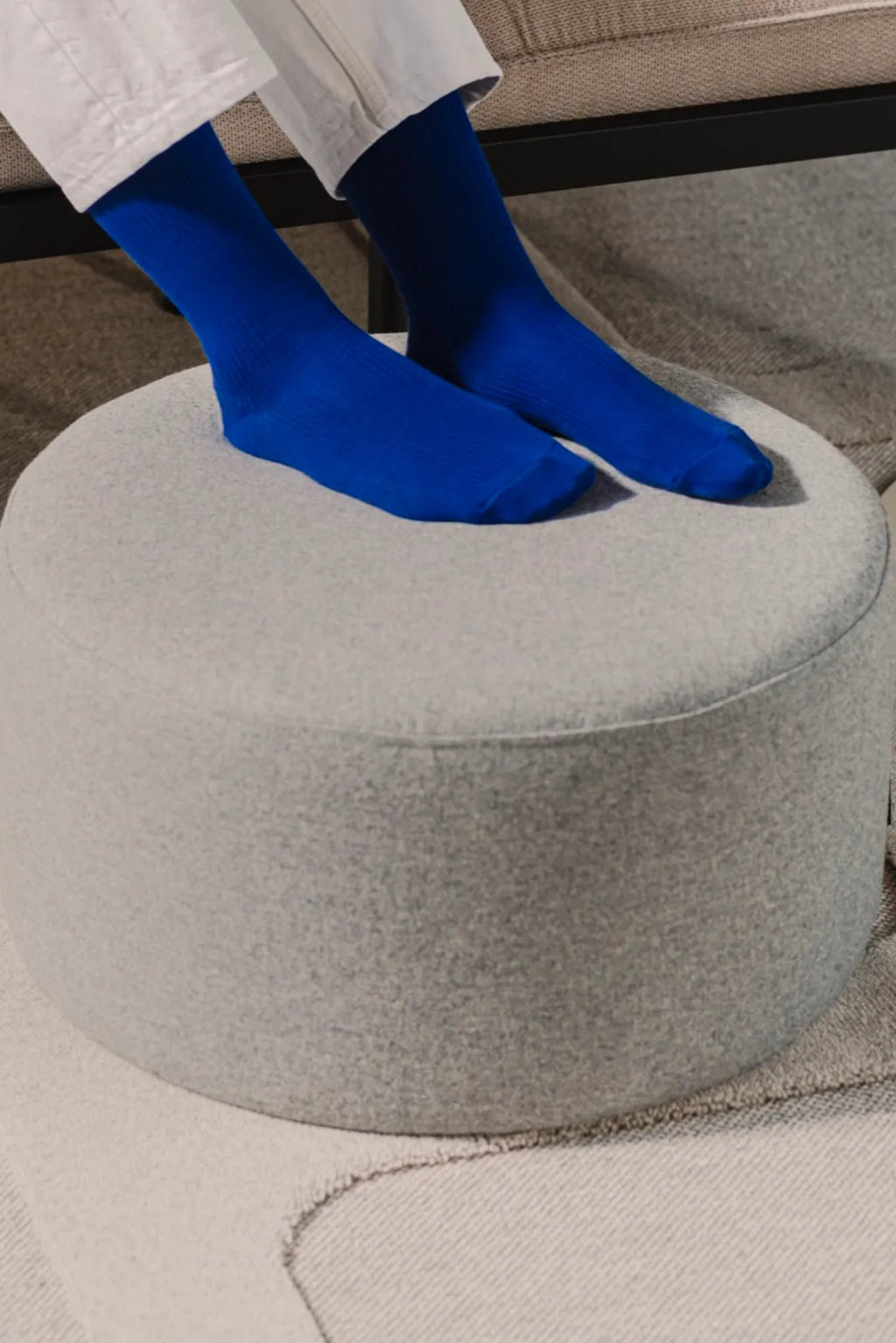 Folk Pouf - Low featuring intricate handwoven patterns and fringed edges