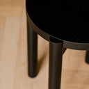 Modern wooden Hopp Stool with round seat and sleek design