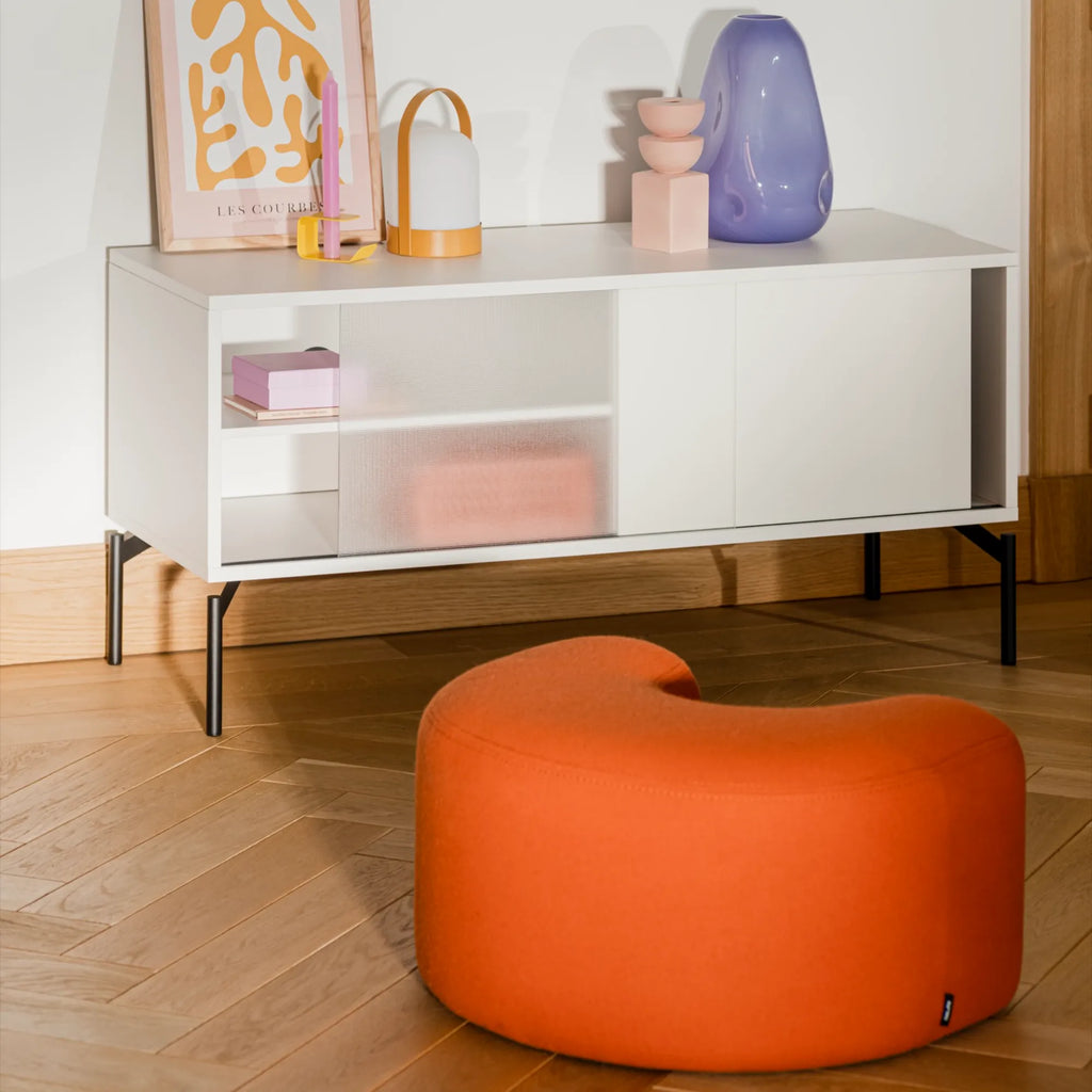 Detail of Ü Pouf in sandstone, displaying its modern and versatile design