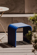  Nokk Stool featured in a cozy reading nook, offering both comfort and style