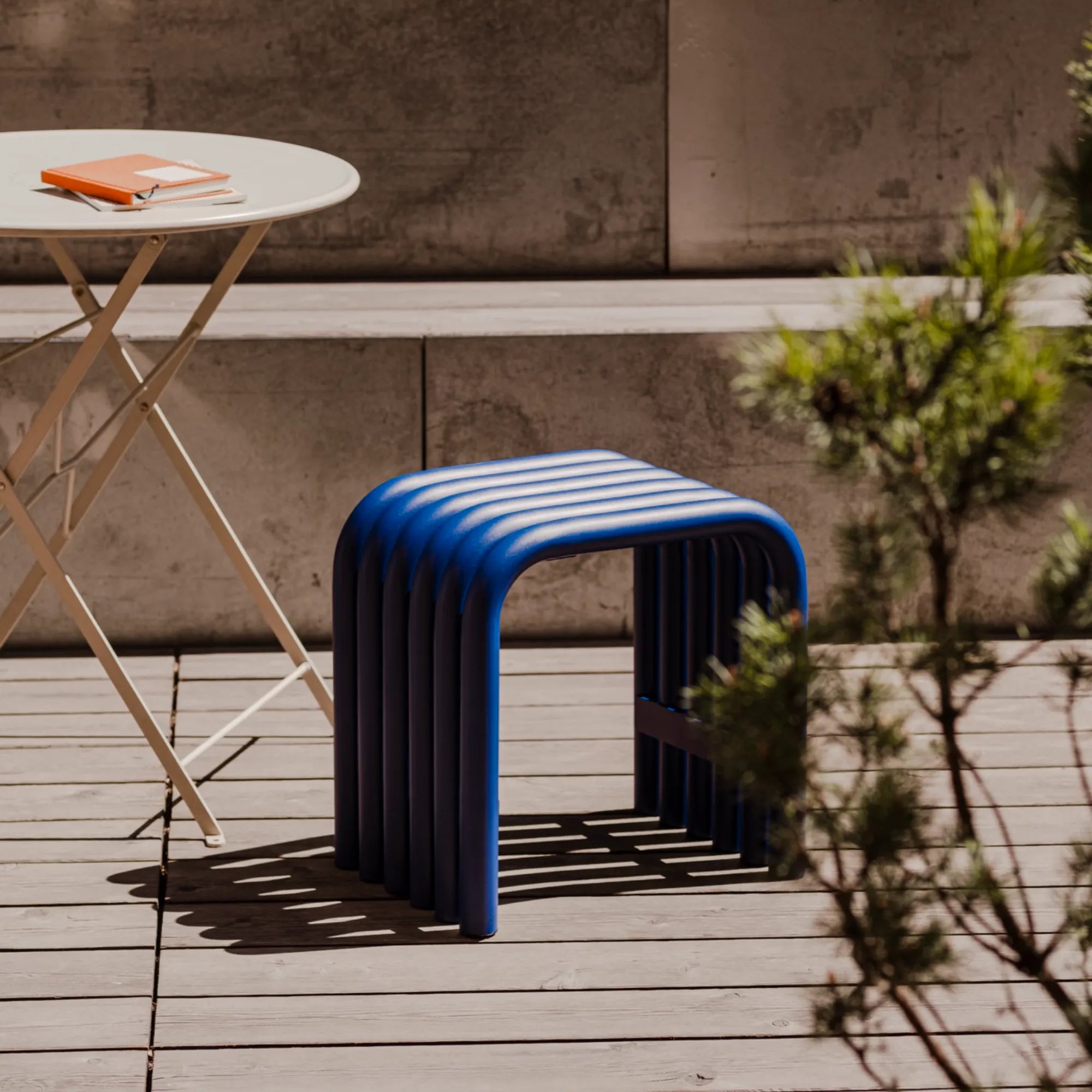  Nokk Stool featured in a cozy reading nook, offering both comfort and style