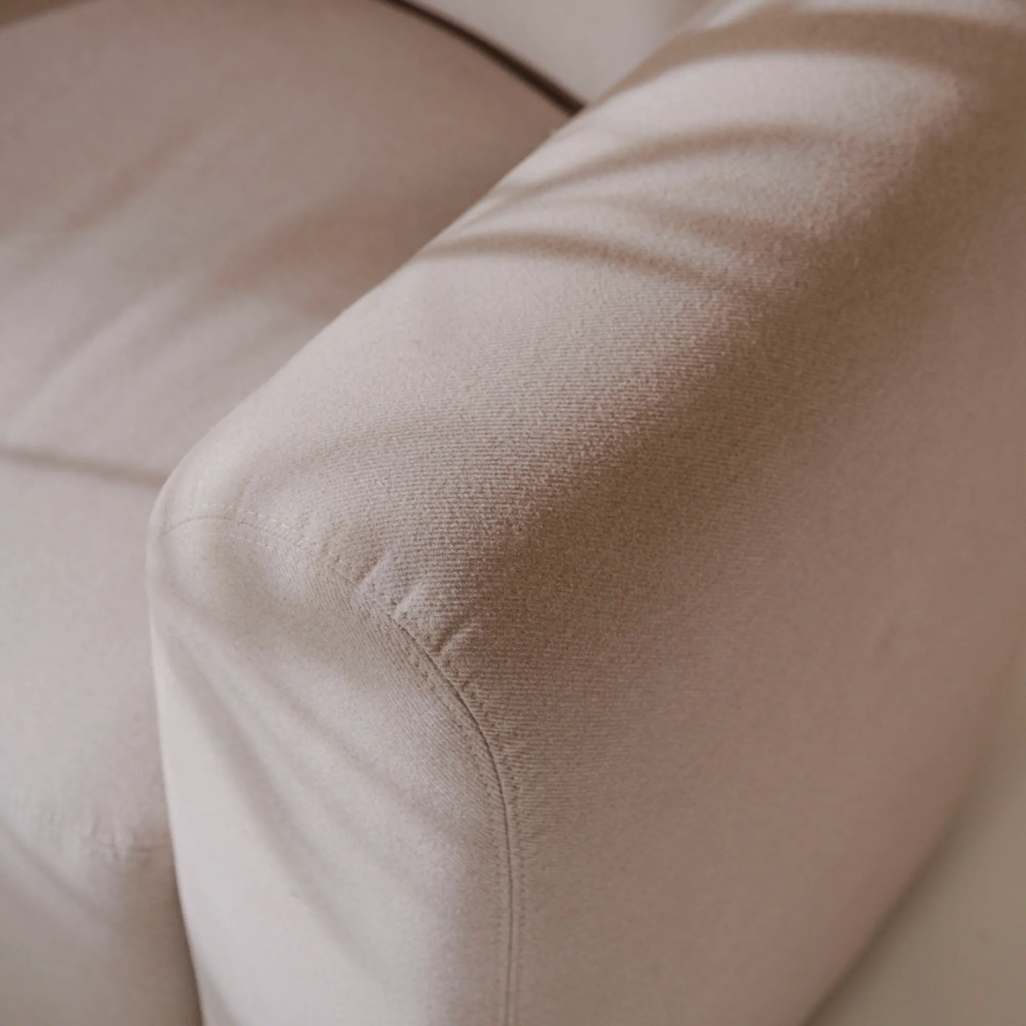  Flom Armchair in cozy white fabric with chic mid-century modern appeal