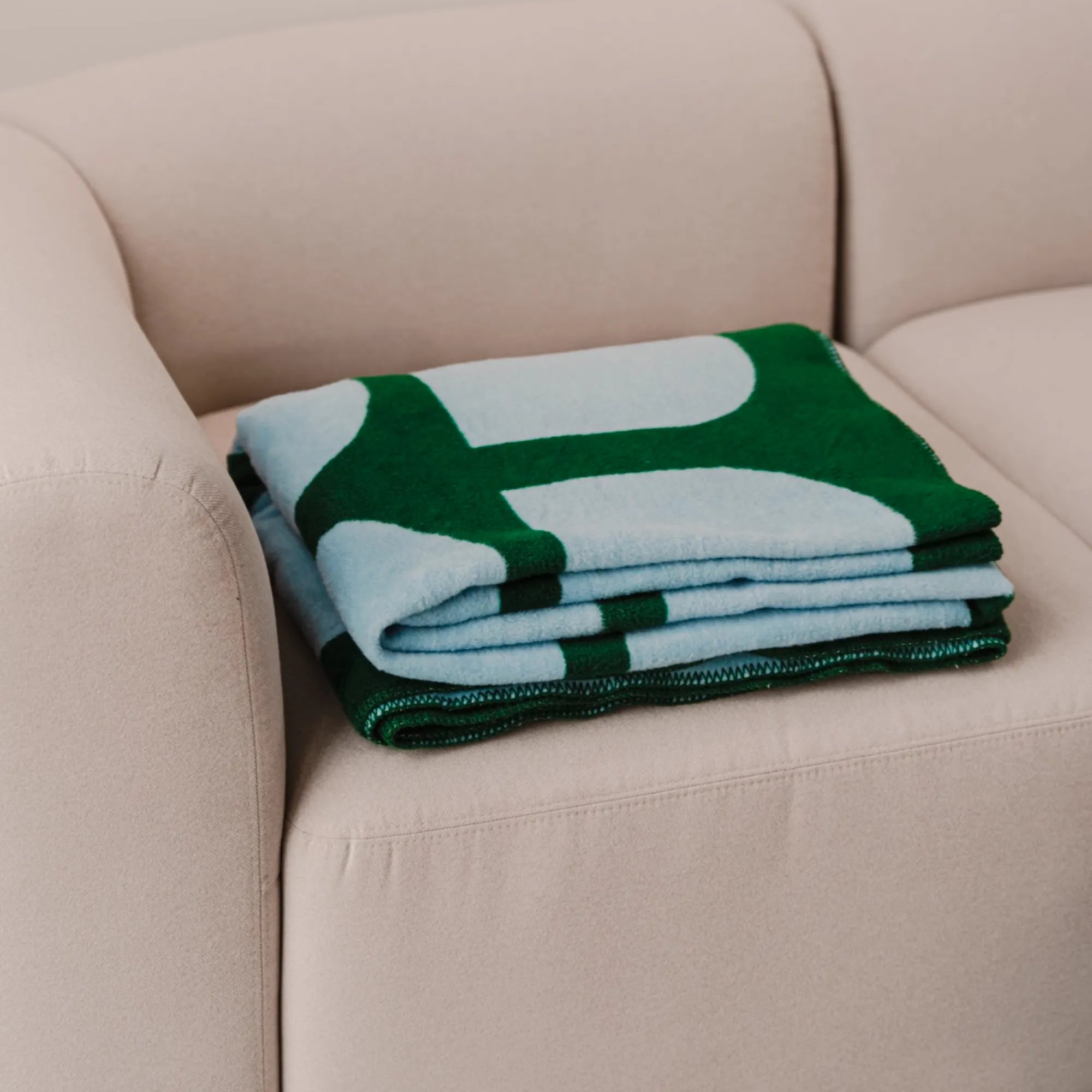Soft and luxurious Gilli throw blanket in a beautiful neutral color