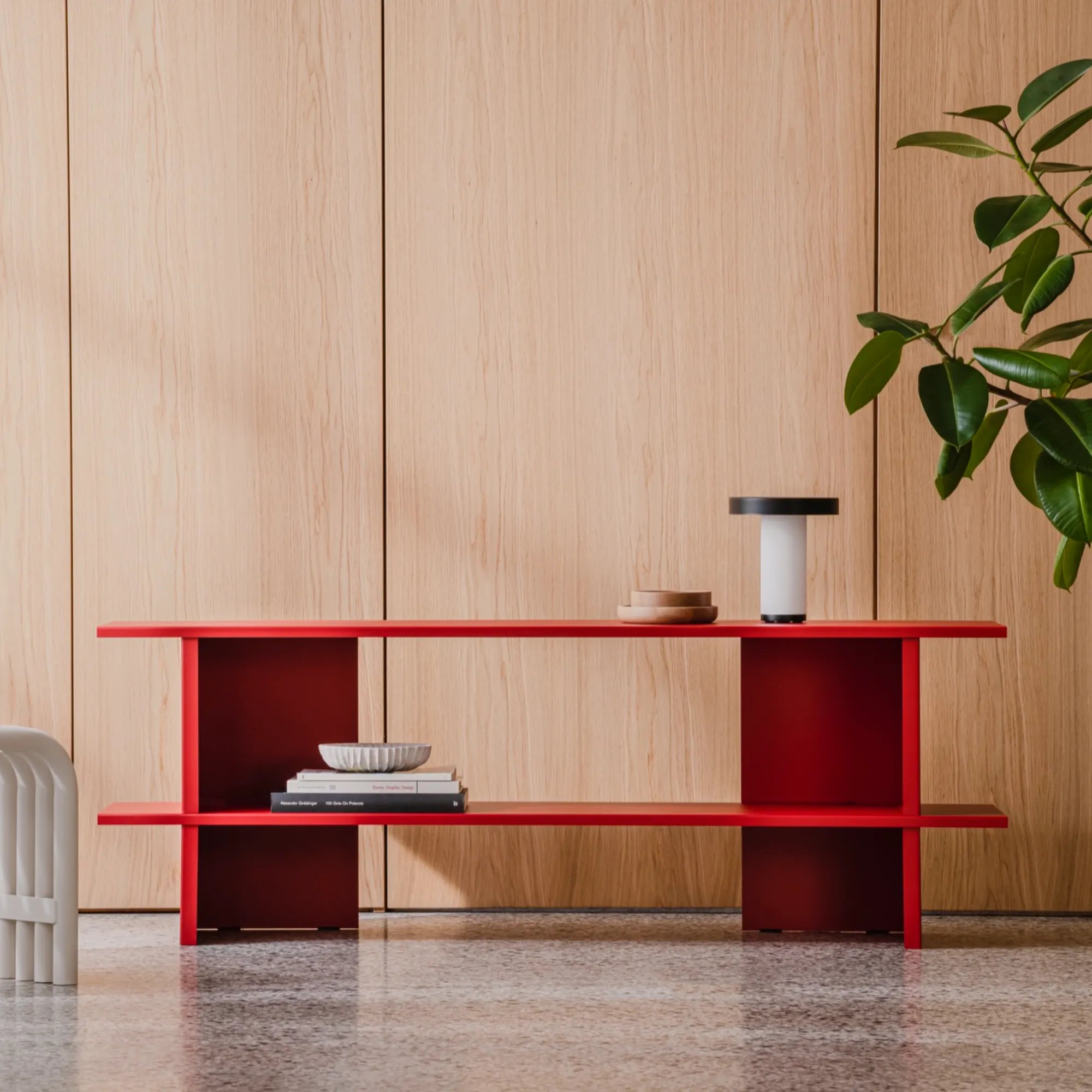 Versatile Hes Shelving Unit with multiple tiers to display books, decor, and more in style