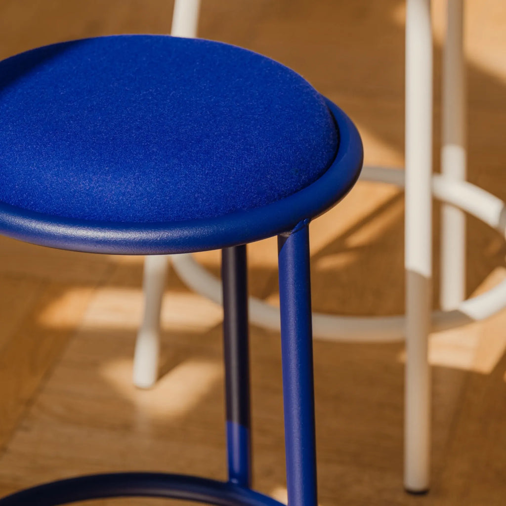 noo.ma Hogo Bar Stool w Backrest, a modern minimalist bar stool featuring a vibrant royal blue upholstered seat with a plush textured finish and a matching matte royal blue tubular metal frame with slender.