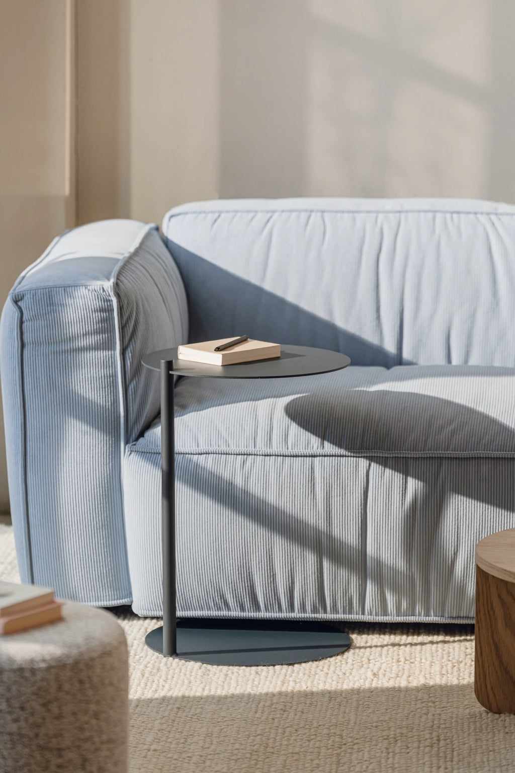 noo.ma Lobi Sofa 3-seater, a contemporary light blue corduroy sofa featuring a plush, ribbed texture and a soft, rounded silhouette with deep, comfortable seating. This inviting 3-seater couch offers a relaxed modern aesthetic, perfect for minimalist living rooms or Scandinavian-inspired interiors.