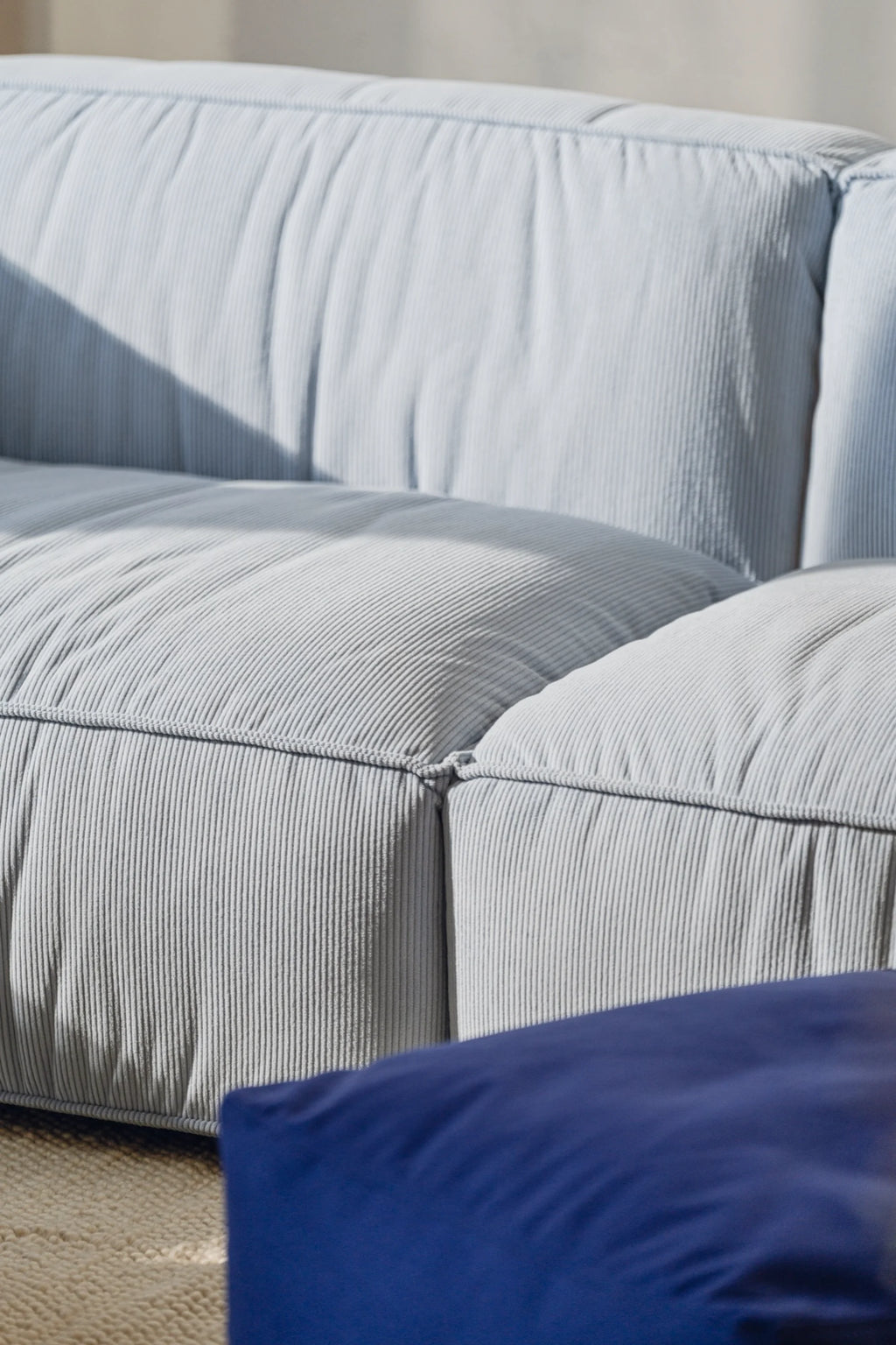 noo.ma Lobi Sofa 3-seater, a contemporary modular sofa upholstered in a soft pale grey corduroy fabric featuring a plush ribbed texture and deep, inviting cushions.