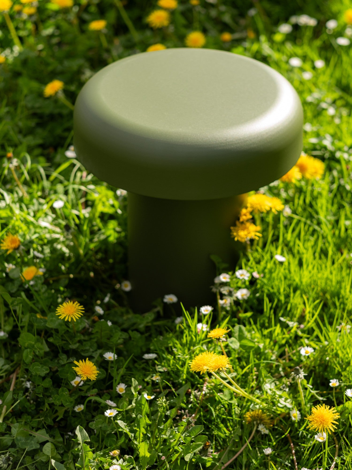 noo.ma Outdoor Miko Side Table, an olive green mushroom-shaped outdoor side table with a smooth, matte powder-coated metal finish, featuring a round top and a sturdy cylindrical base.