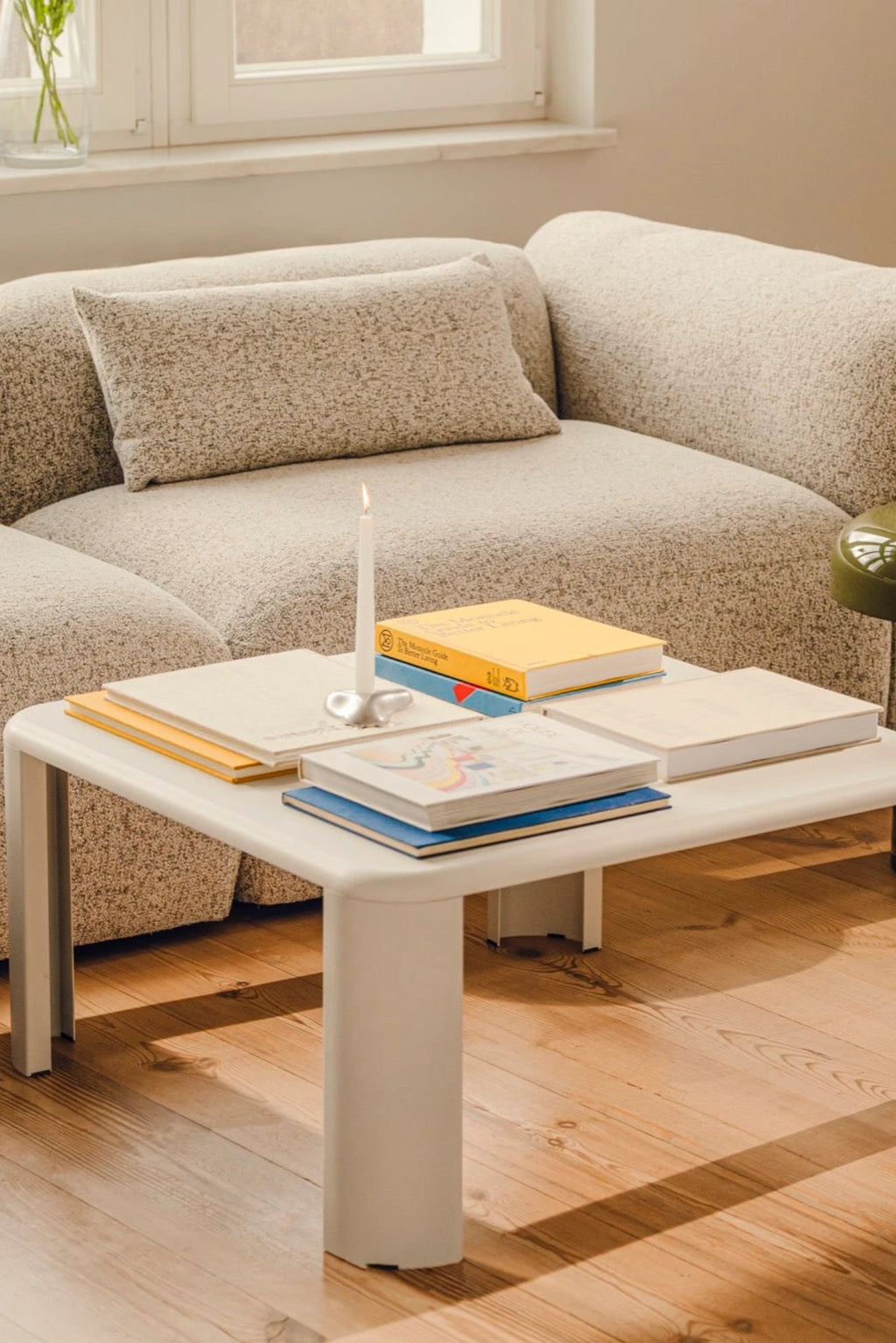 noo.ma Fli Coffee Table, a modern minimalist coffee table crafted from smooth matte white metal, featuring a rectangular top with subtly rounded corners and thick, blocky legs for a clean, contemporary silhouette. This versatile white accent table is perfect for Scandinavian living rooms or organic modern spaces seeking functional and stylish furniture.