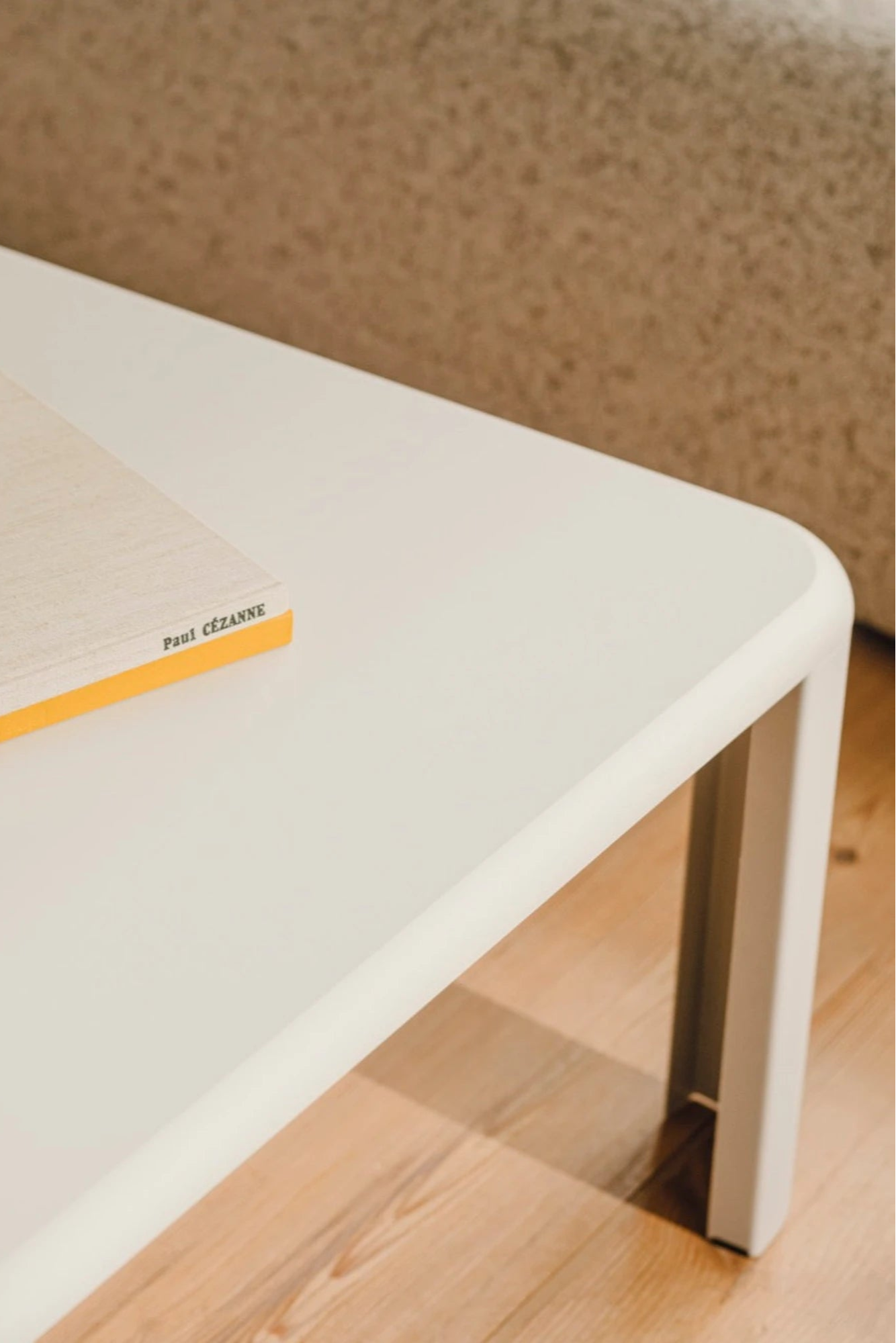 noo.ma Fli Coffee Table, a modern minimalist rectangular coffee table featuring a smooth matte white finish and gently rounded corners, supported by sleek square-profile legs.