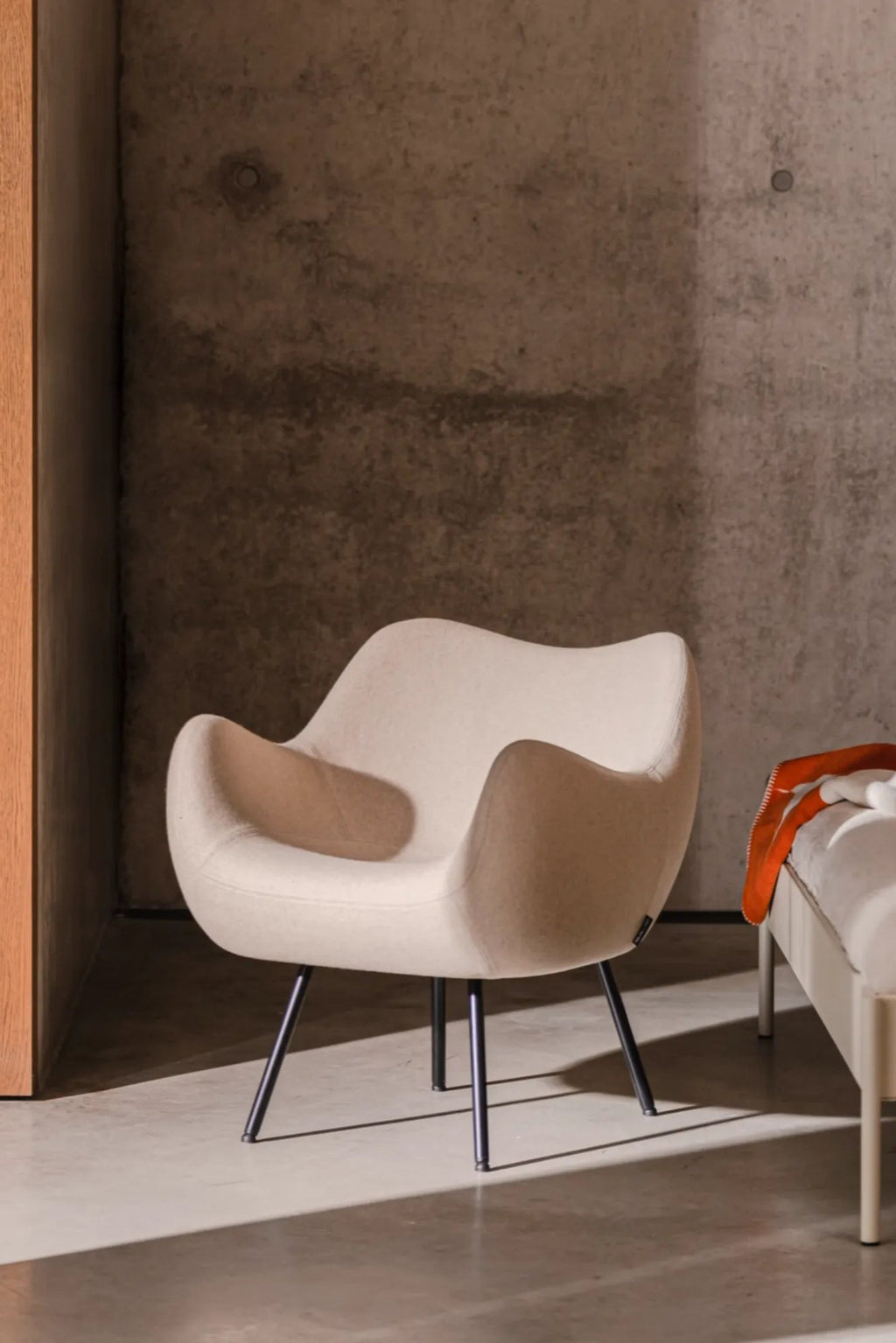  Close-up of RM58 Armchair's comfortable cushioned seat and backrest