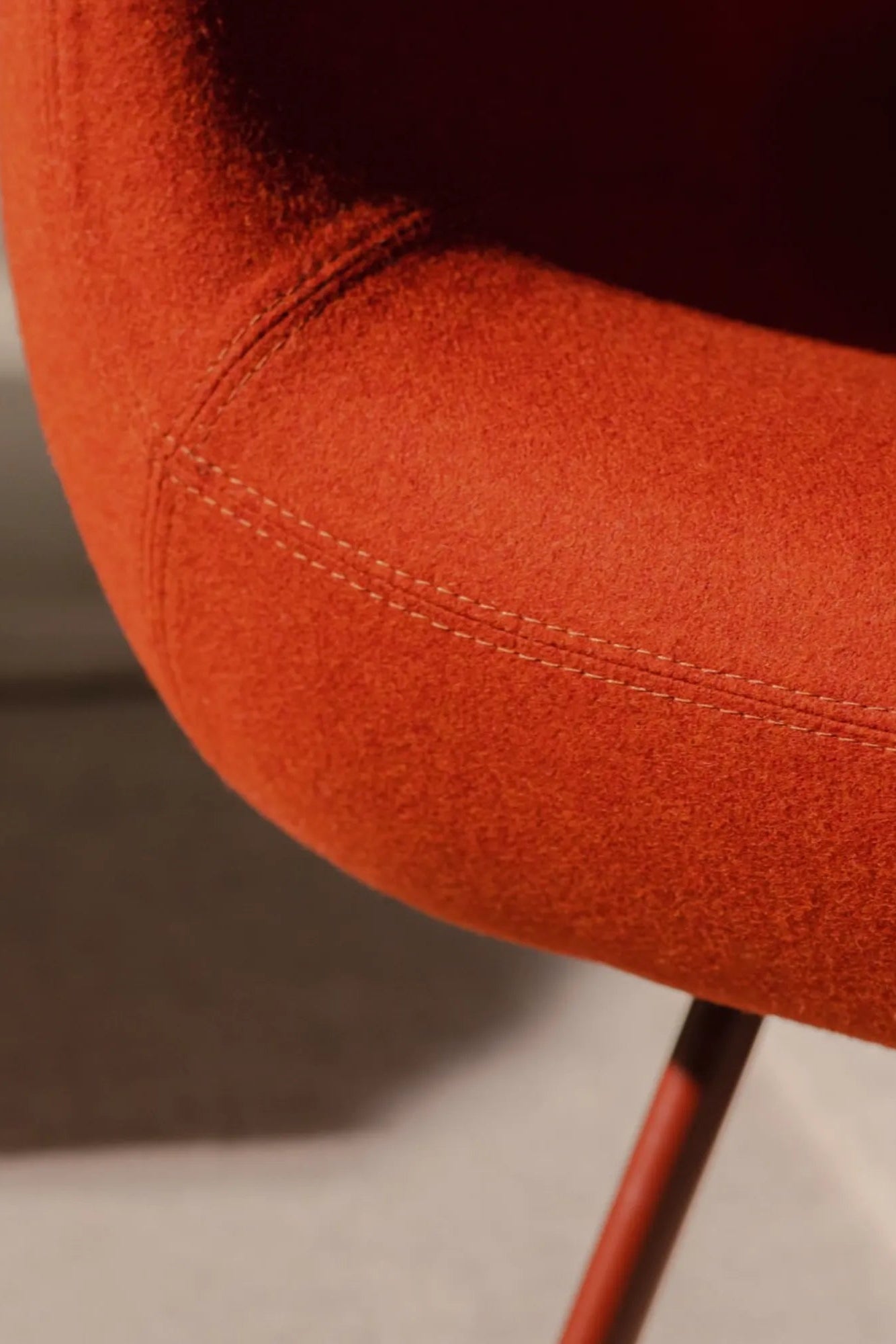 RM58 Armchair in warm, earthy tones, adding a touch of sophistication to any space