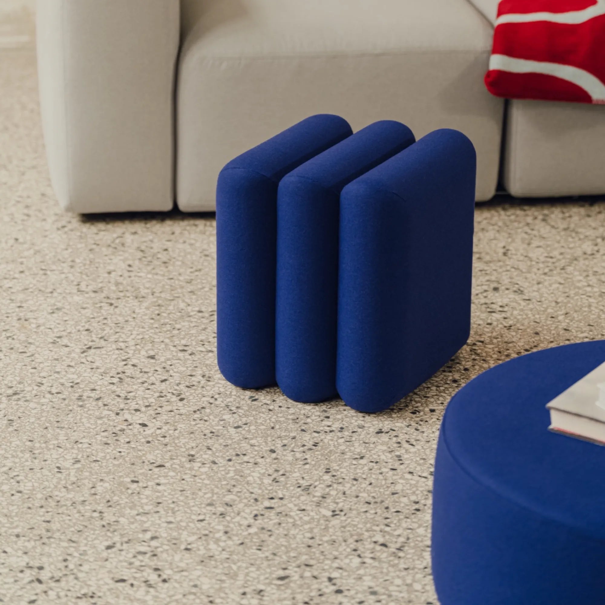 Radd Pouf in versatile and sophisticated gray fabric, suitable for any decor
