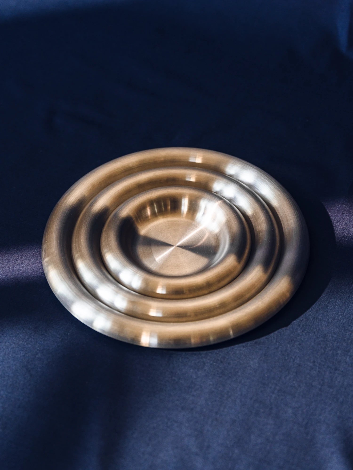 Steel plates on a blue fabric background