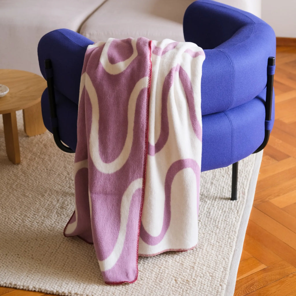 Soft and luxurious Swirl Throw Blanket with fringe detail