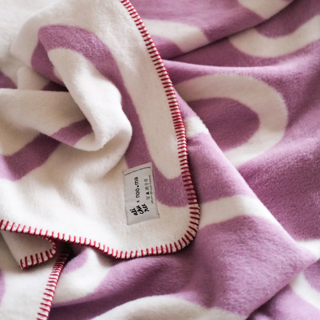 Swirl Throw Blanket draped over a living room sofa