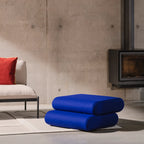 Close-up of Taso Pouf's sturdy wooden frame and plush cushioning